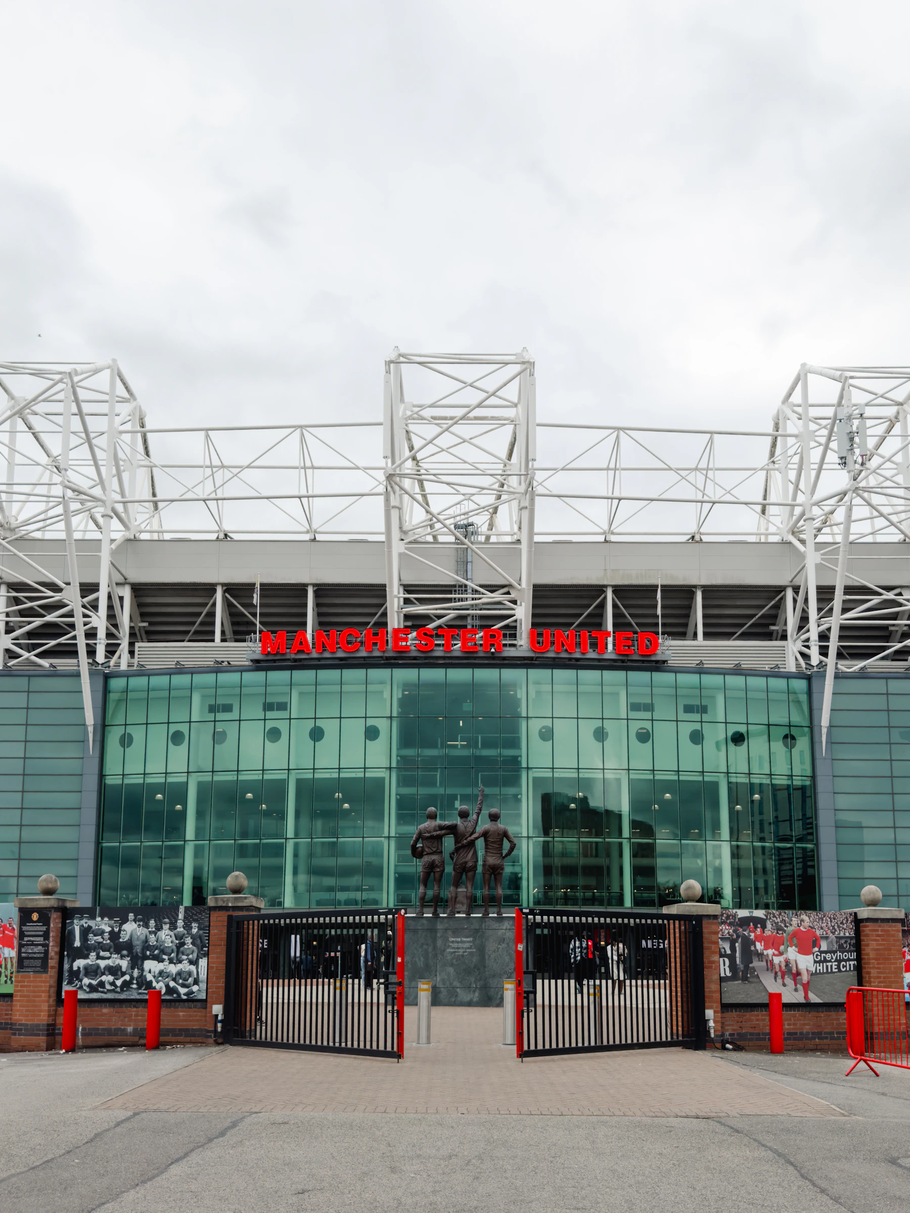 Real photograph of the Old Trafford stadium exterior in Manchester