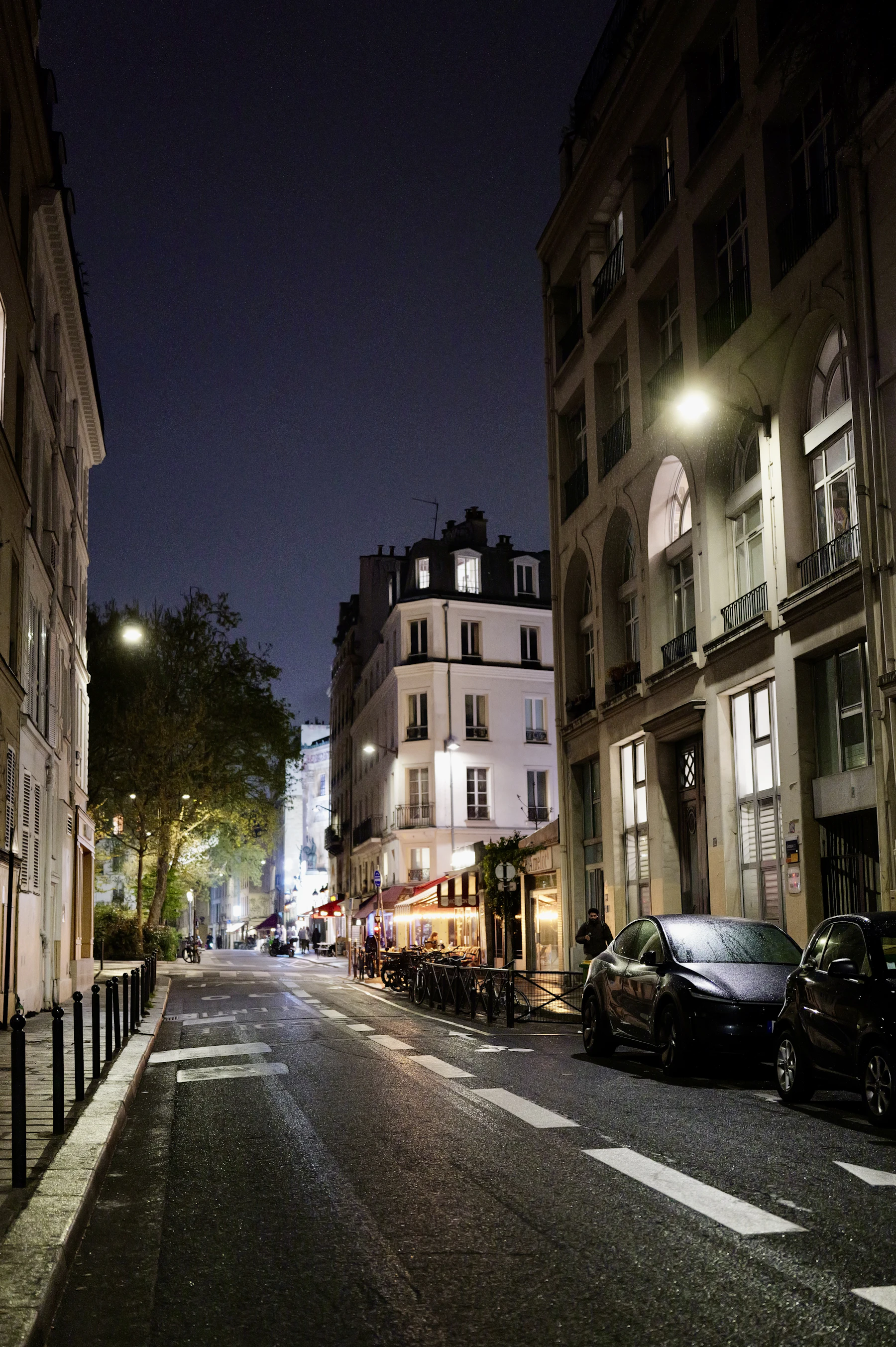 Illustrative travel photograph for this guide: Paris night street glowing windows