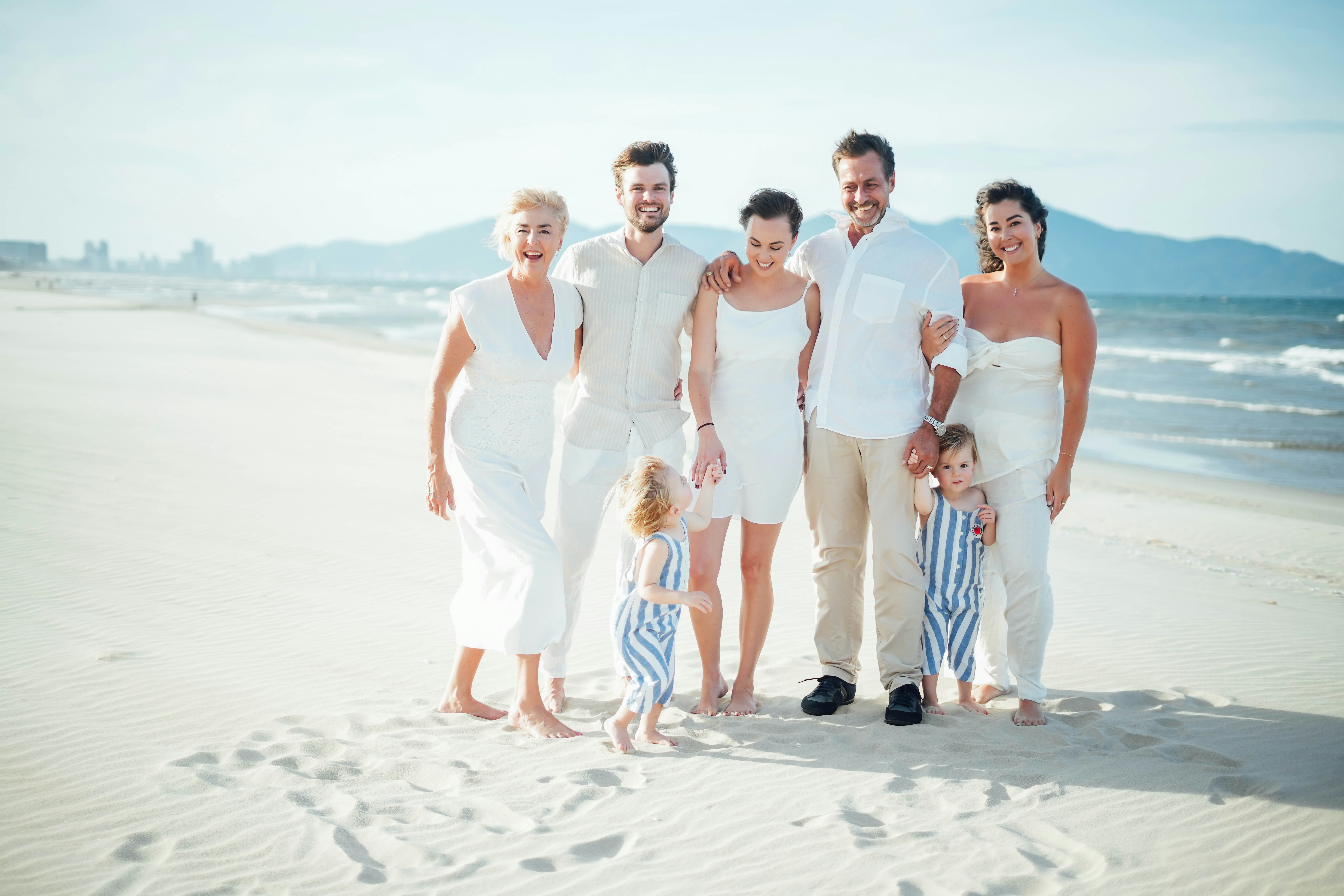 A happy family traveling together on a sunny day - real life financial planning