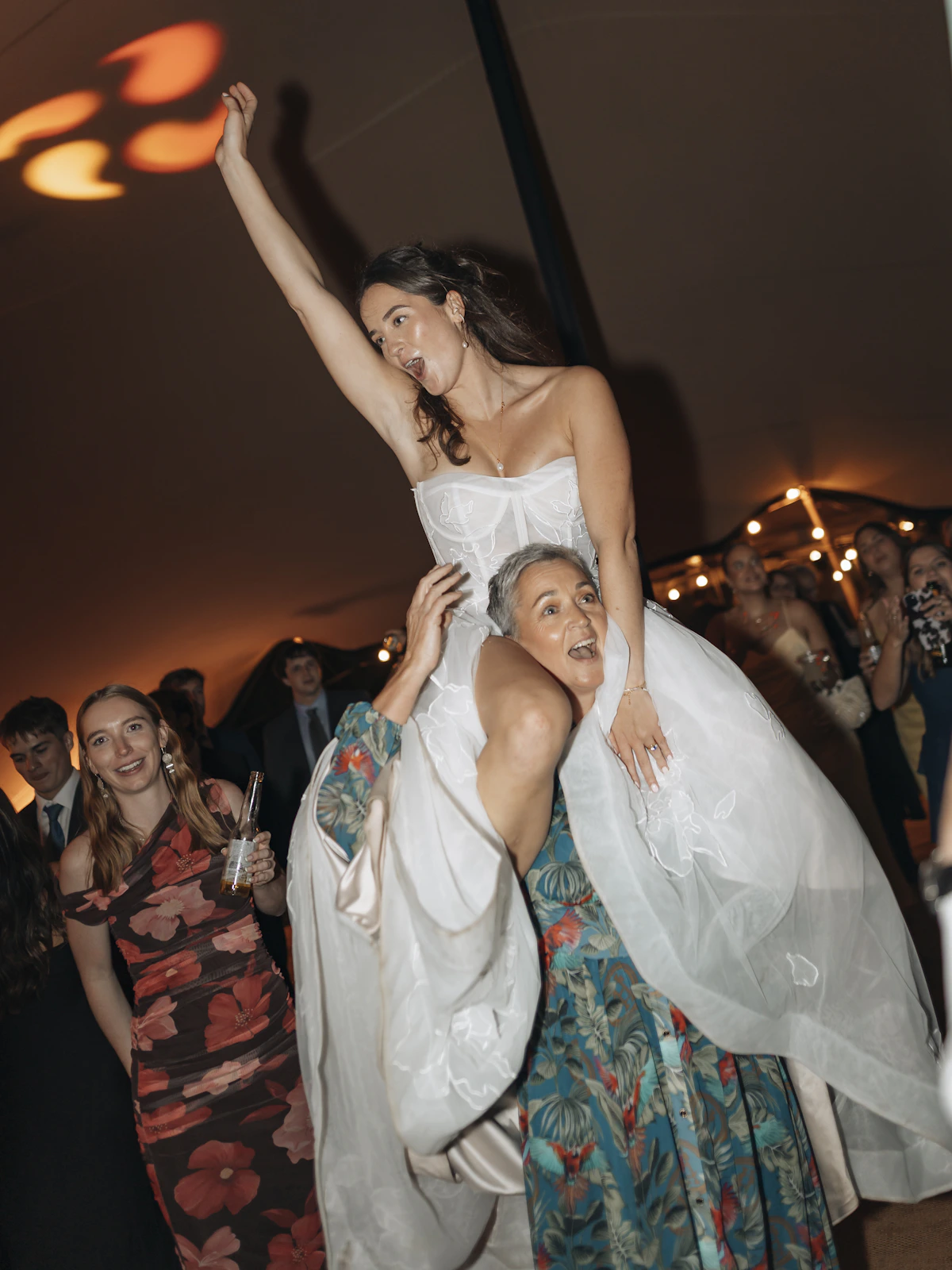 Bride celebrating with wedding guests