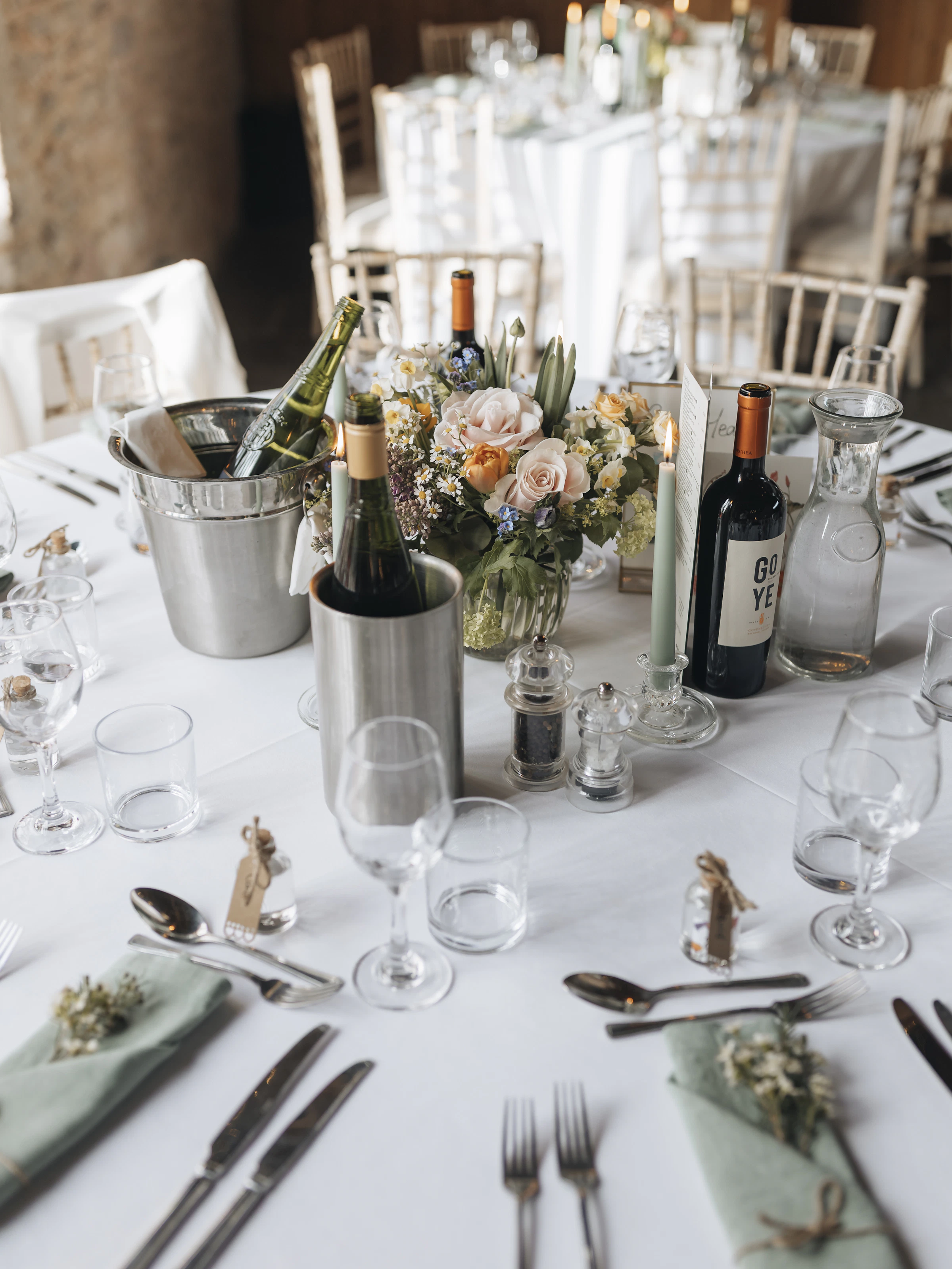 Elegant celebration table arranged with flowers, candles, and tableware