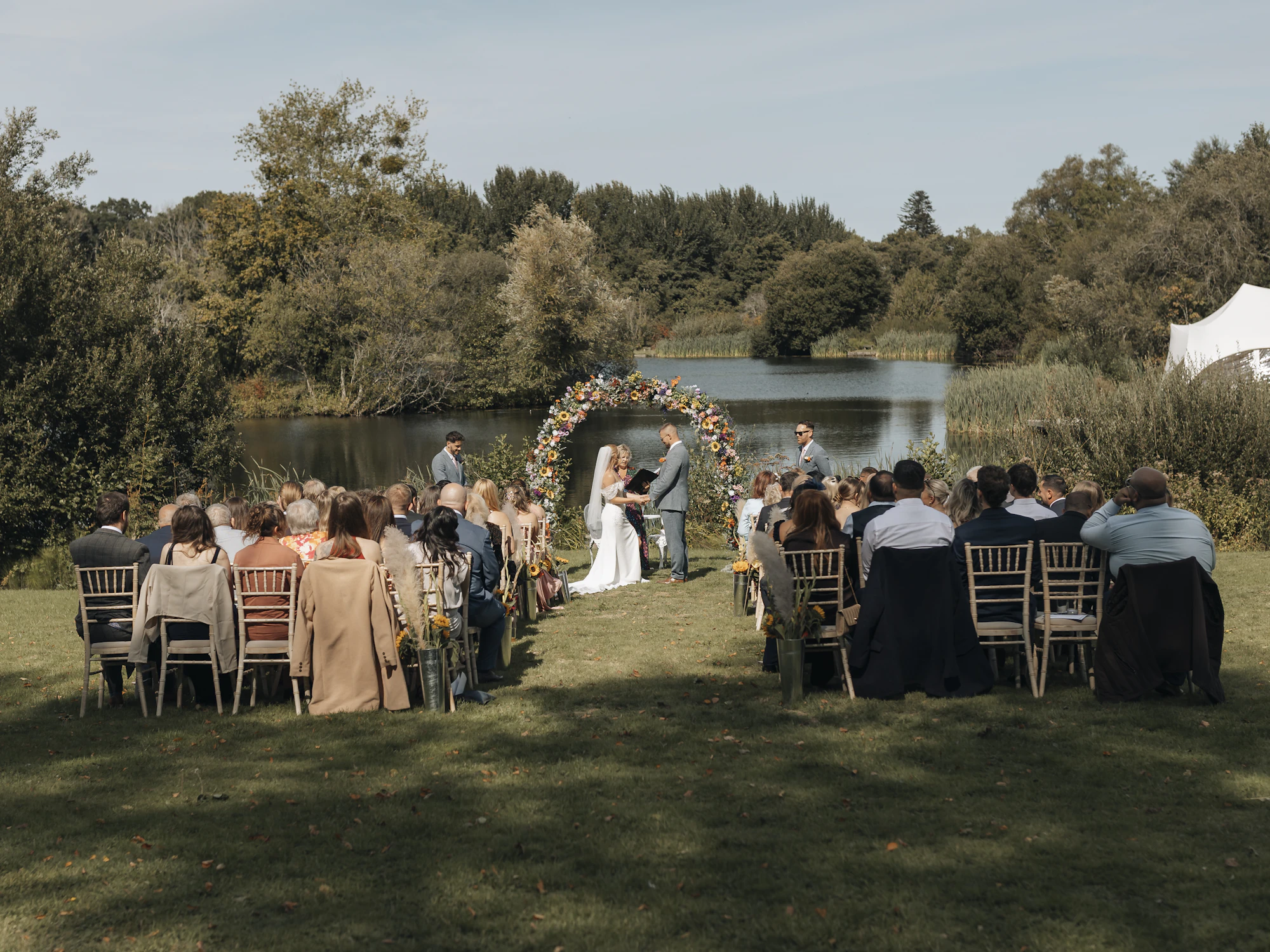 Lakeside wedding ceremony from the back rows