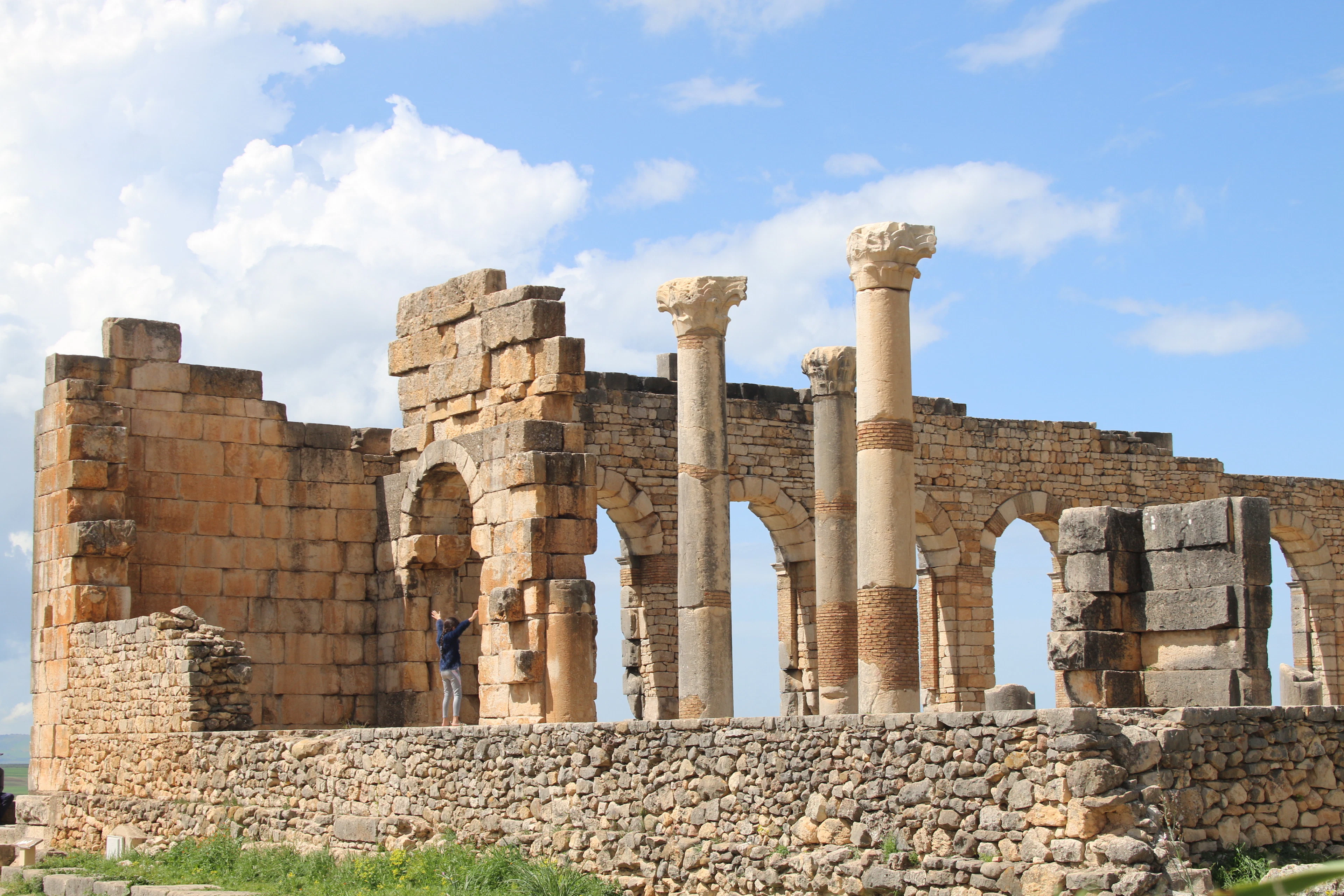 Columns and arches of the Roman basilica at Volubilis, near Meknes, Morocco