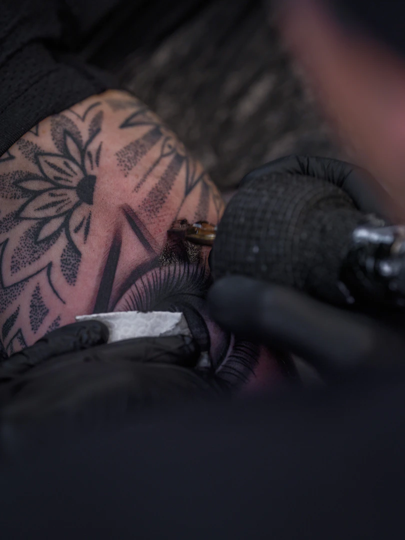 SAKTI tattoo artist working on intricate fine line design