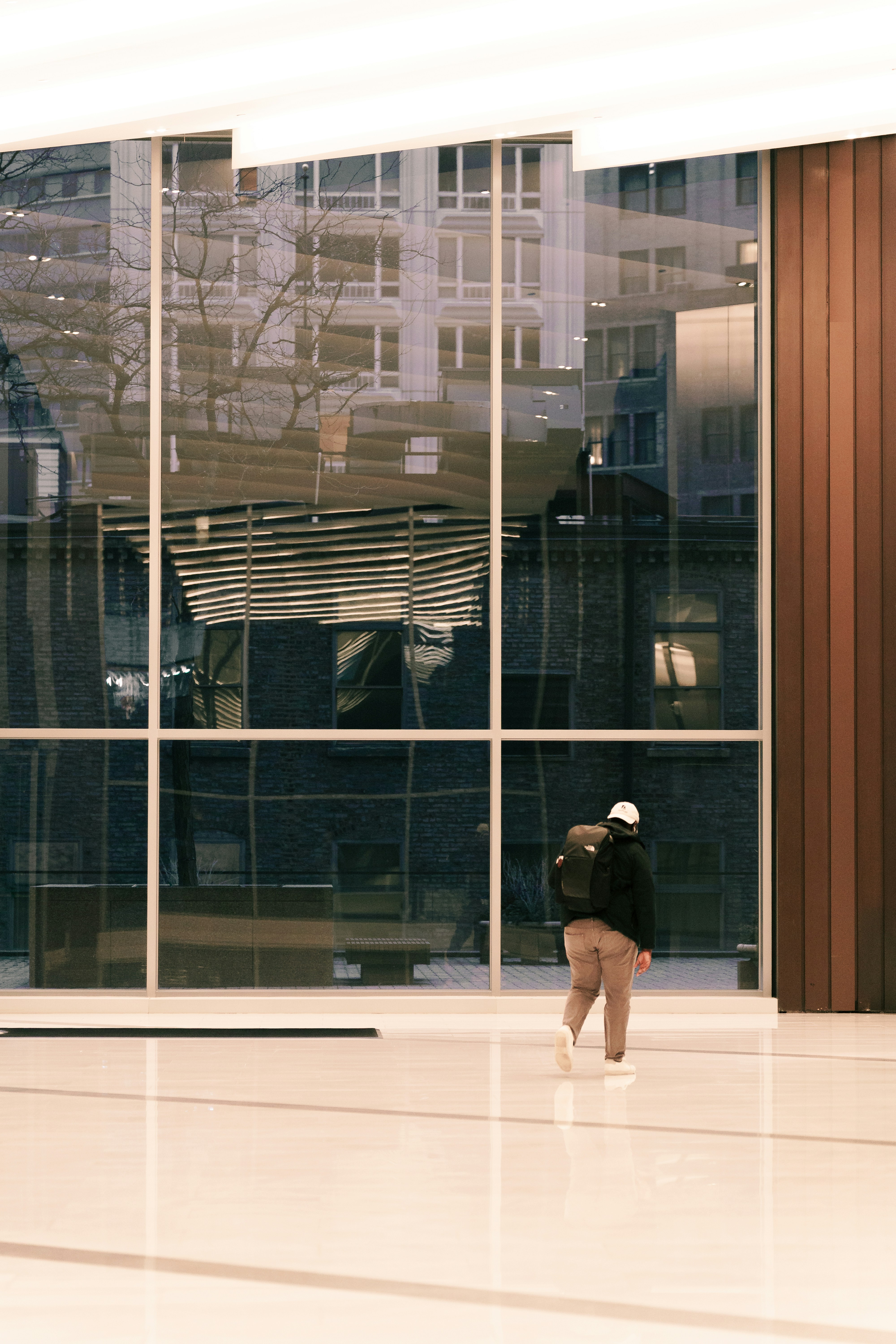 Professional woman walking through a modern office, smiling