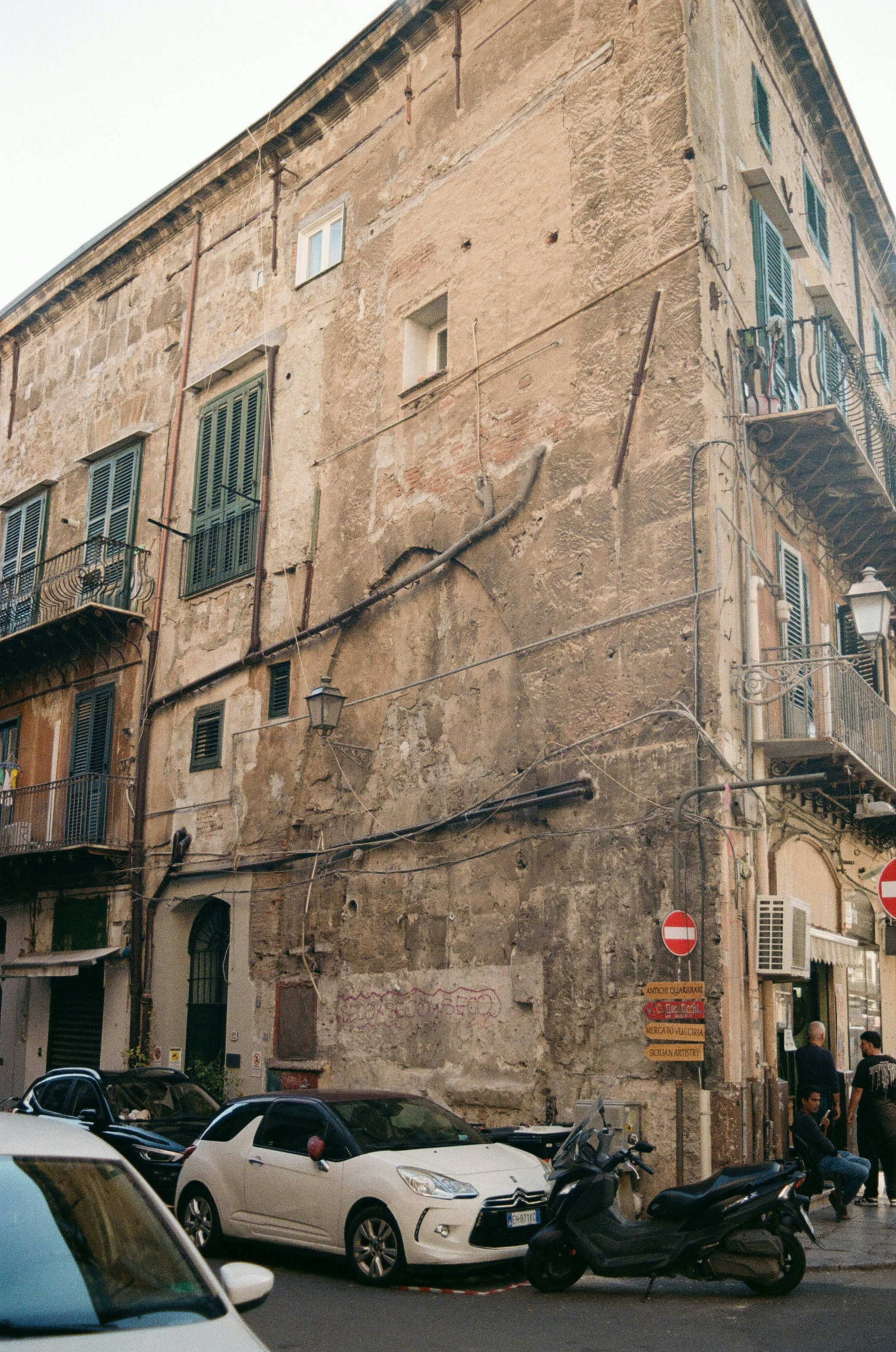 Old buildings and parked vehicles on a city street