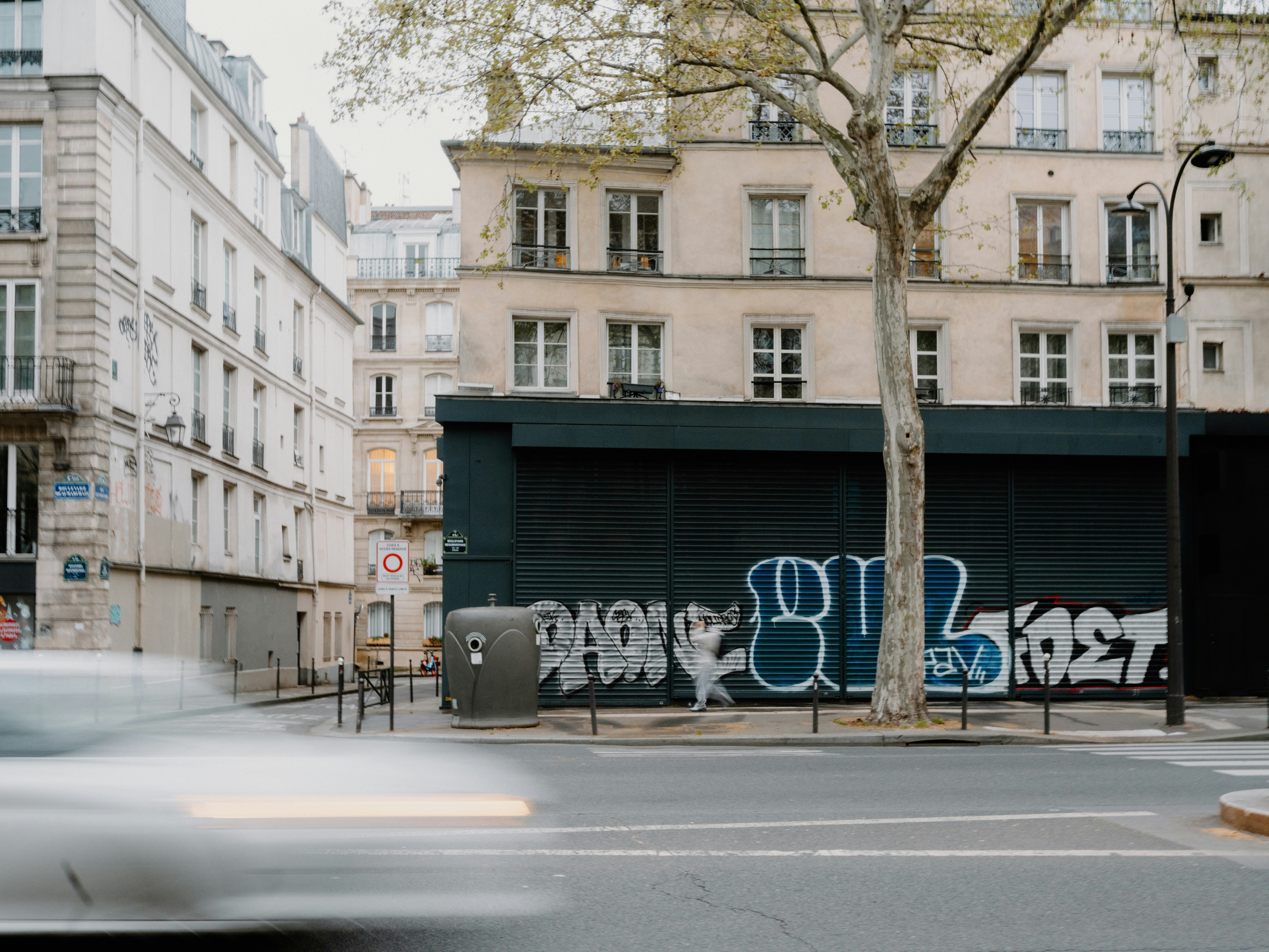 Graffiti on a dark wall in a european city street.