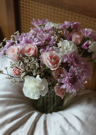 A vase filled with pink and white flowers