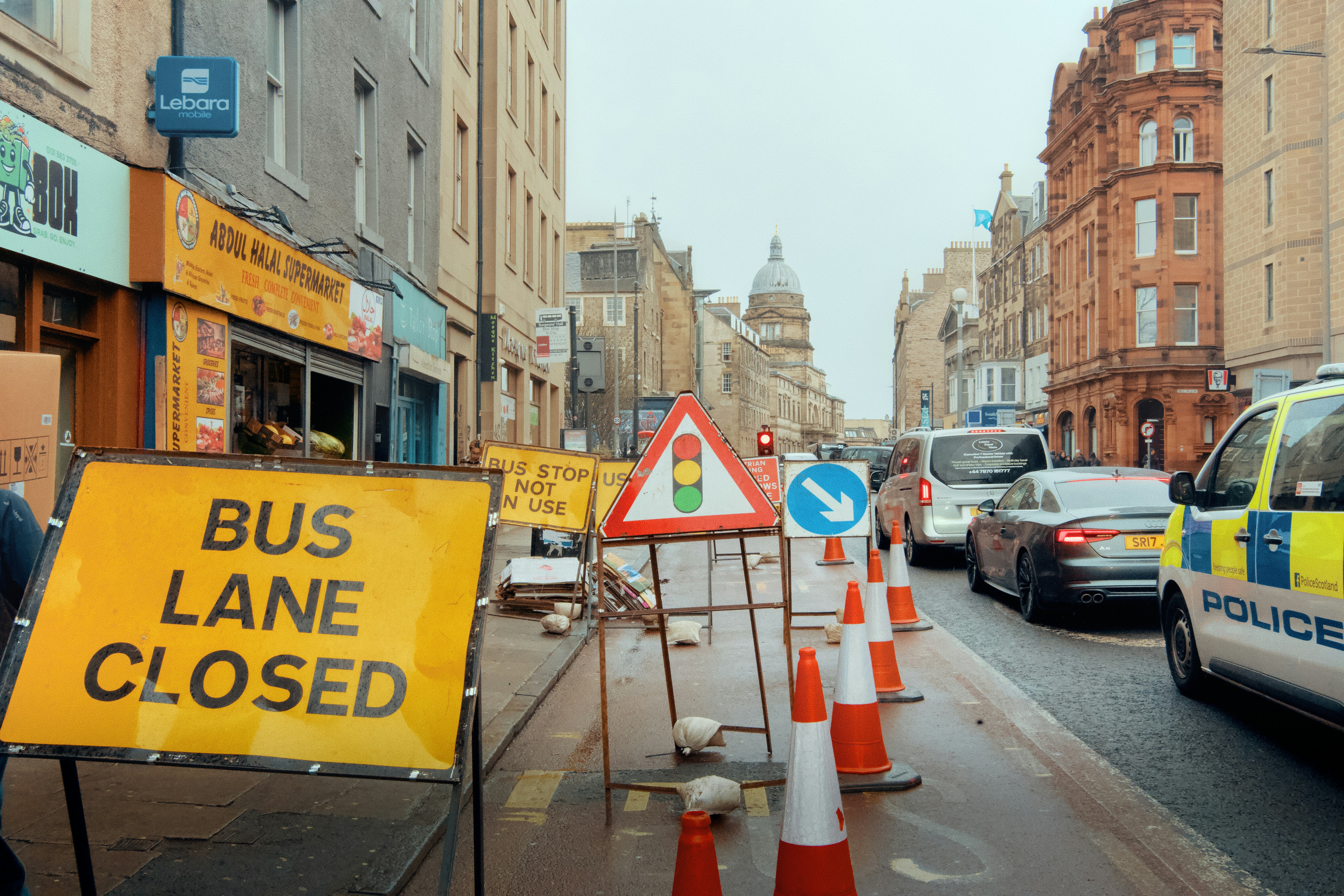 Bus lane closed with traffic cones and signs