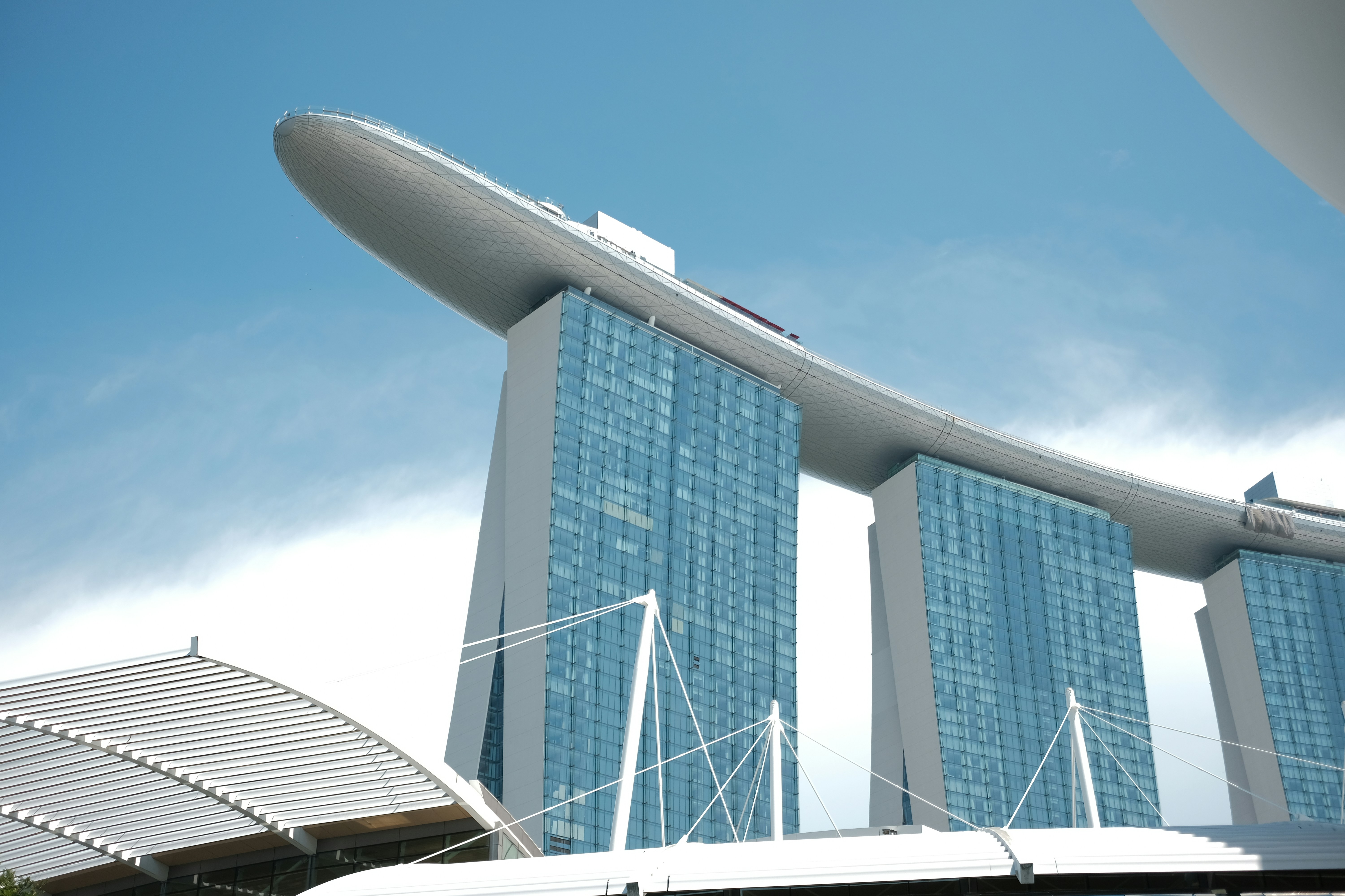 Three modern skyscrapers with a boat-shaped top