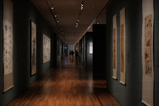 Long museum hallway with artwork on walls