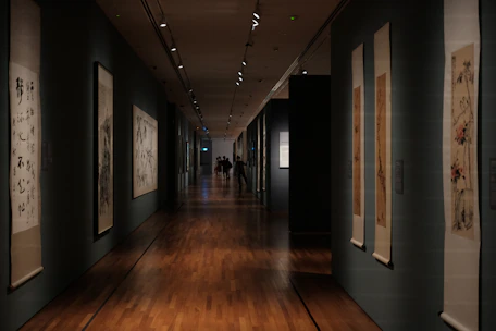 Long museum hallway with artwork on walls