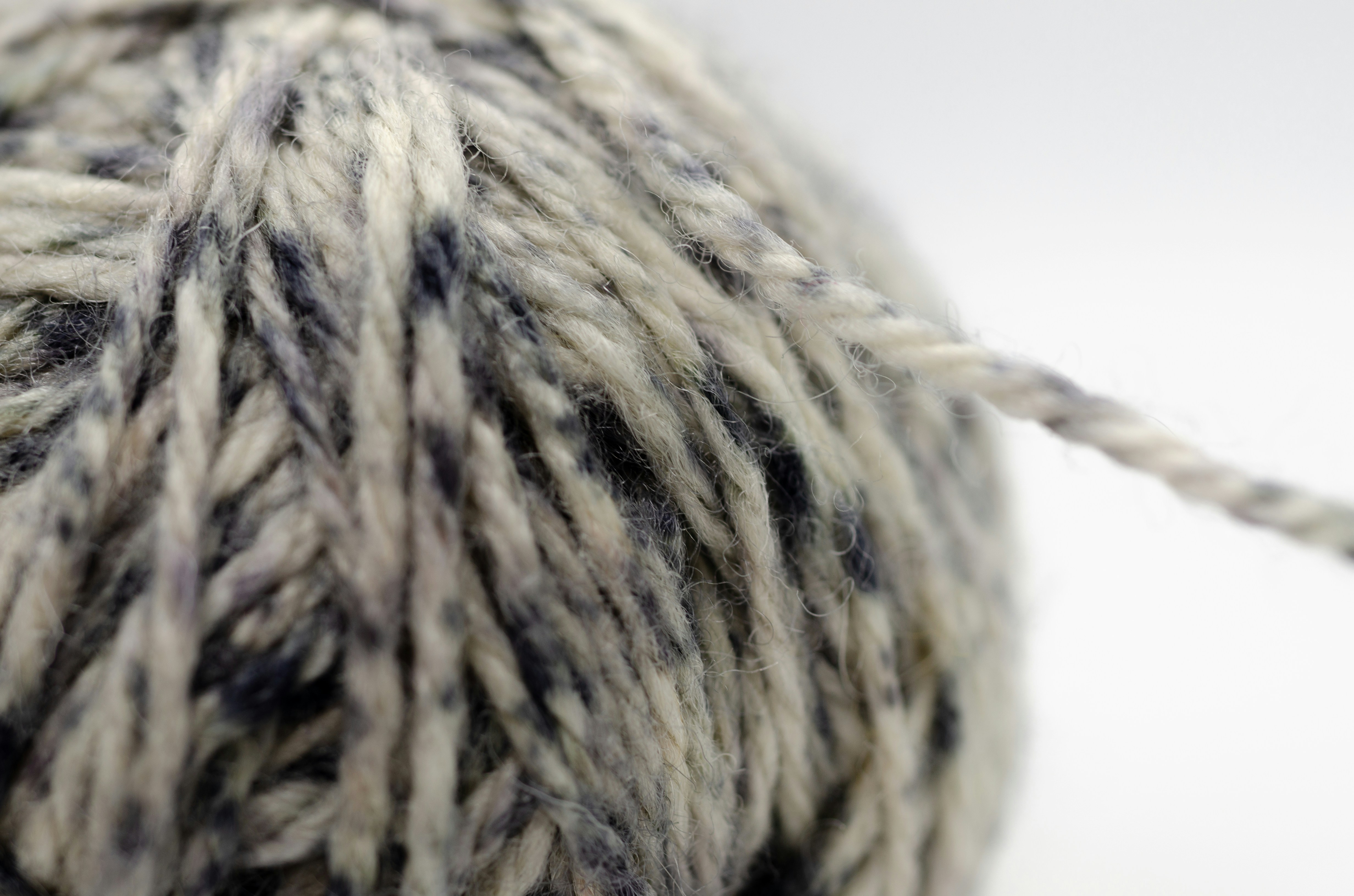 Close-up of a ball of grey and white yarn
