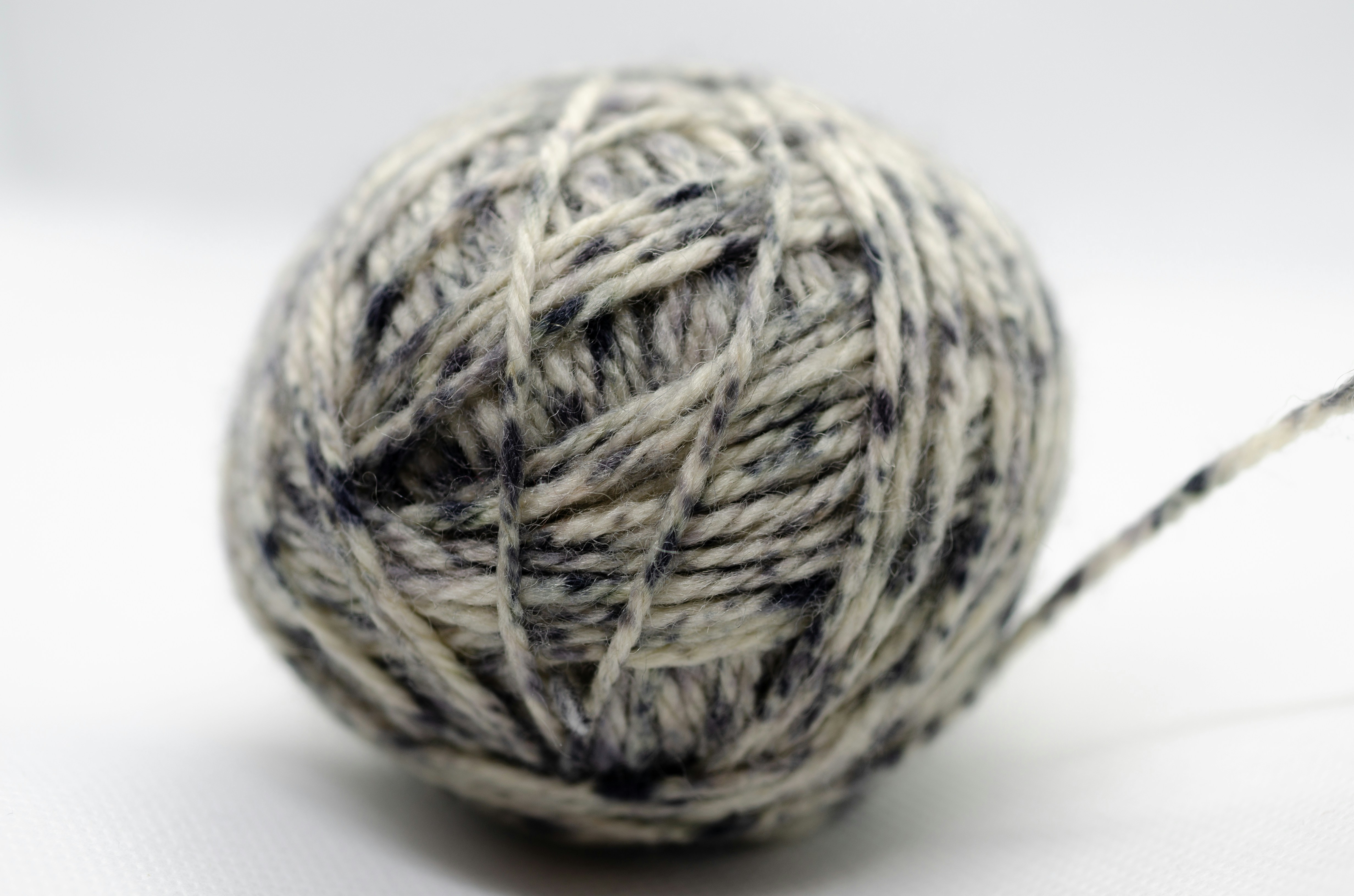 A ball of grey and white yarn