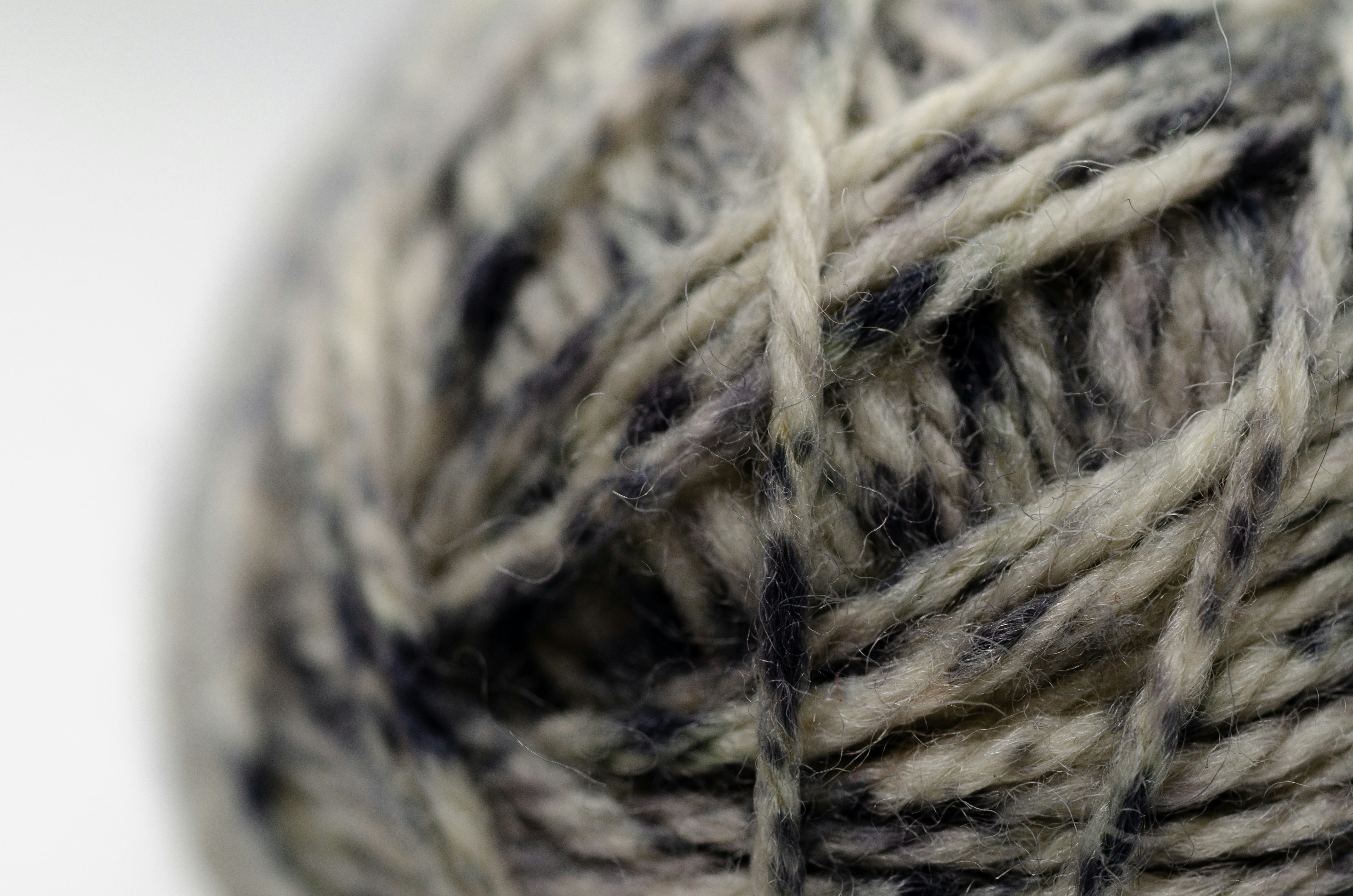 Close-up of a ball of grey and white yarn
