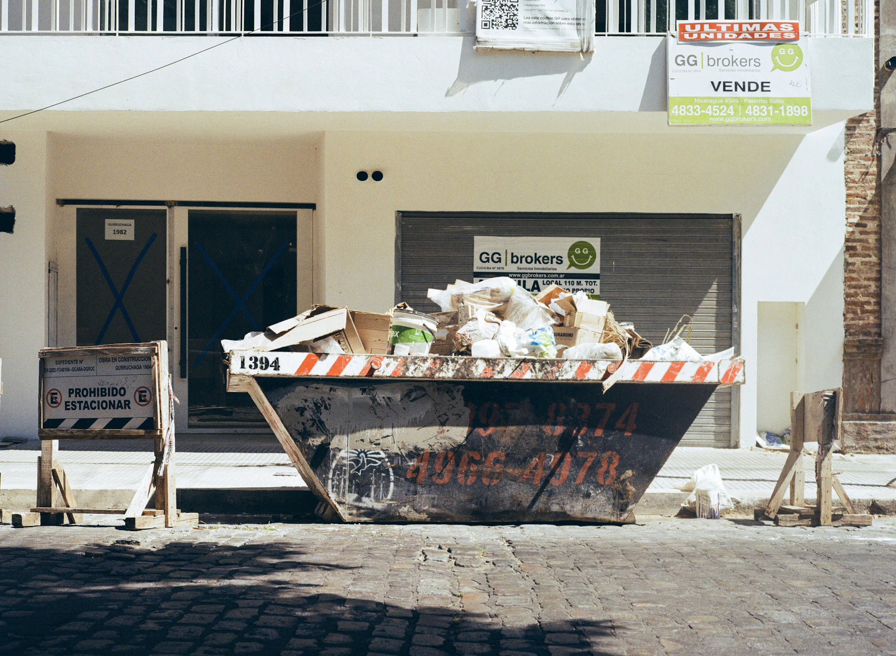 Construction debris container at a property cleanup