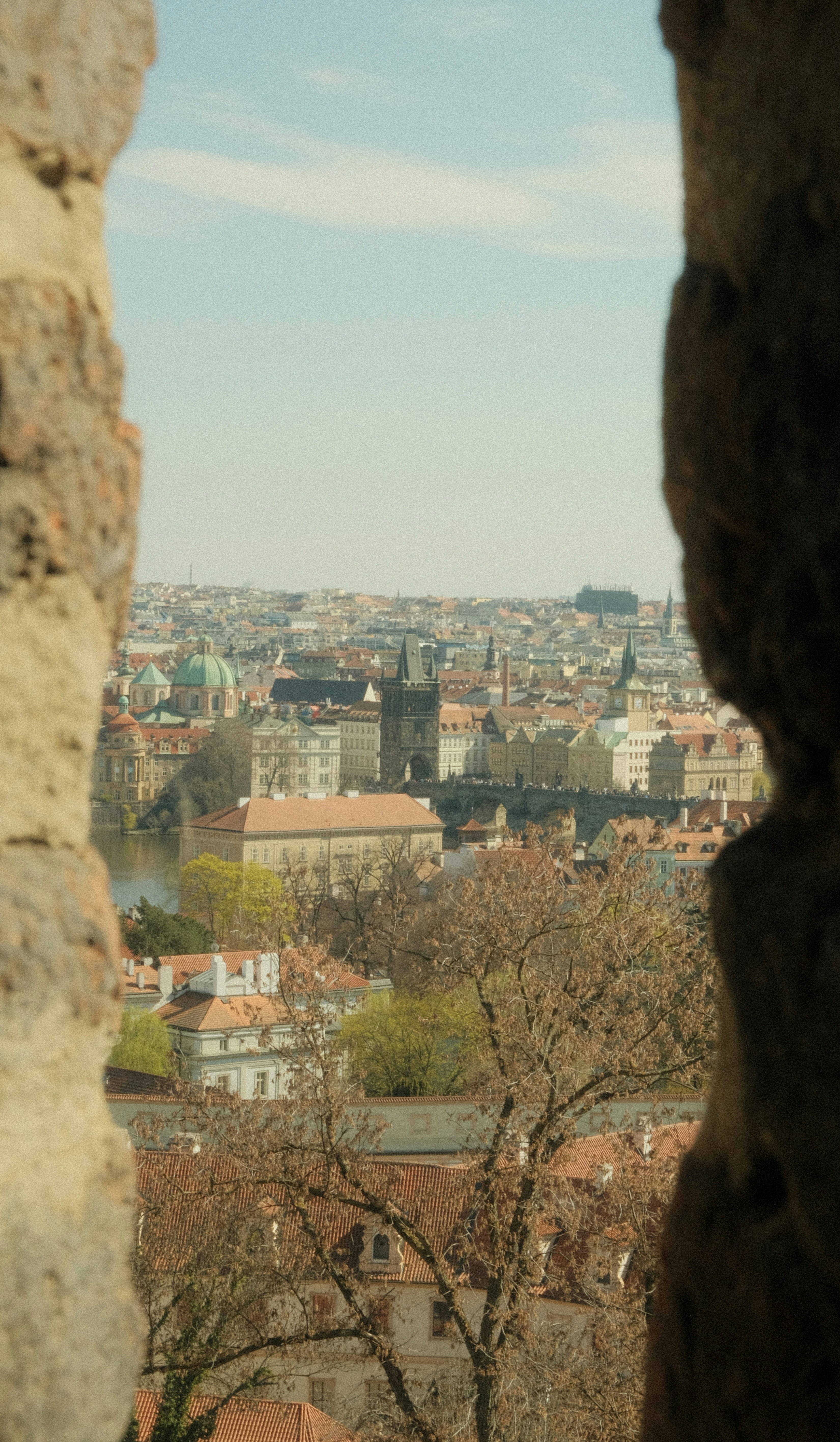 View of a european city skyline through stone opening.