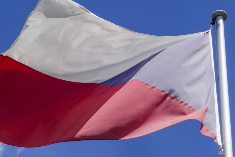 Czech flag waving against a clear blue sky