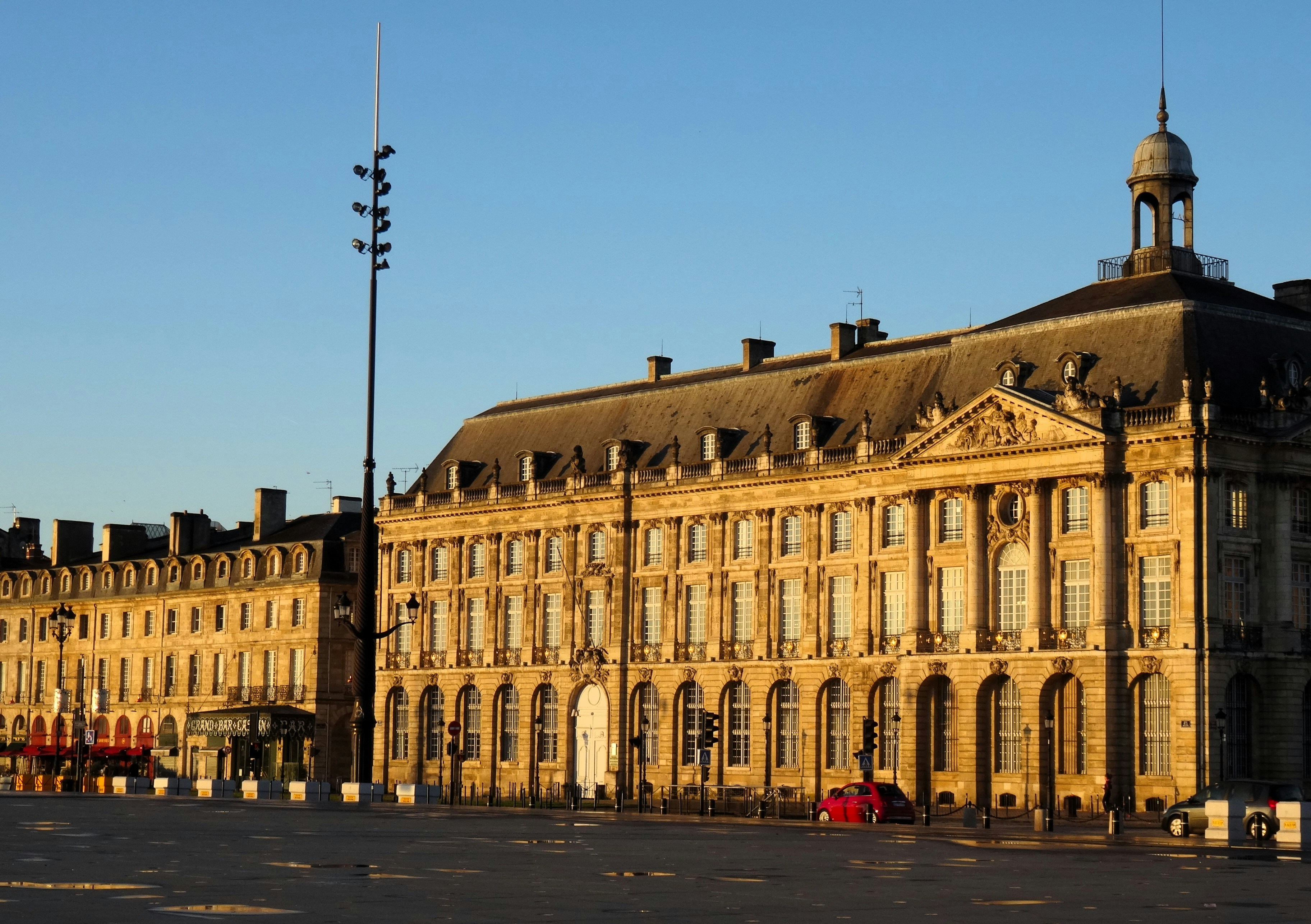 Grand historic buildings under a clear blue sky.