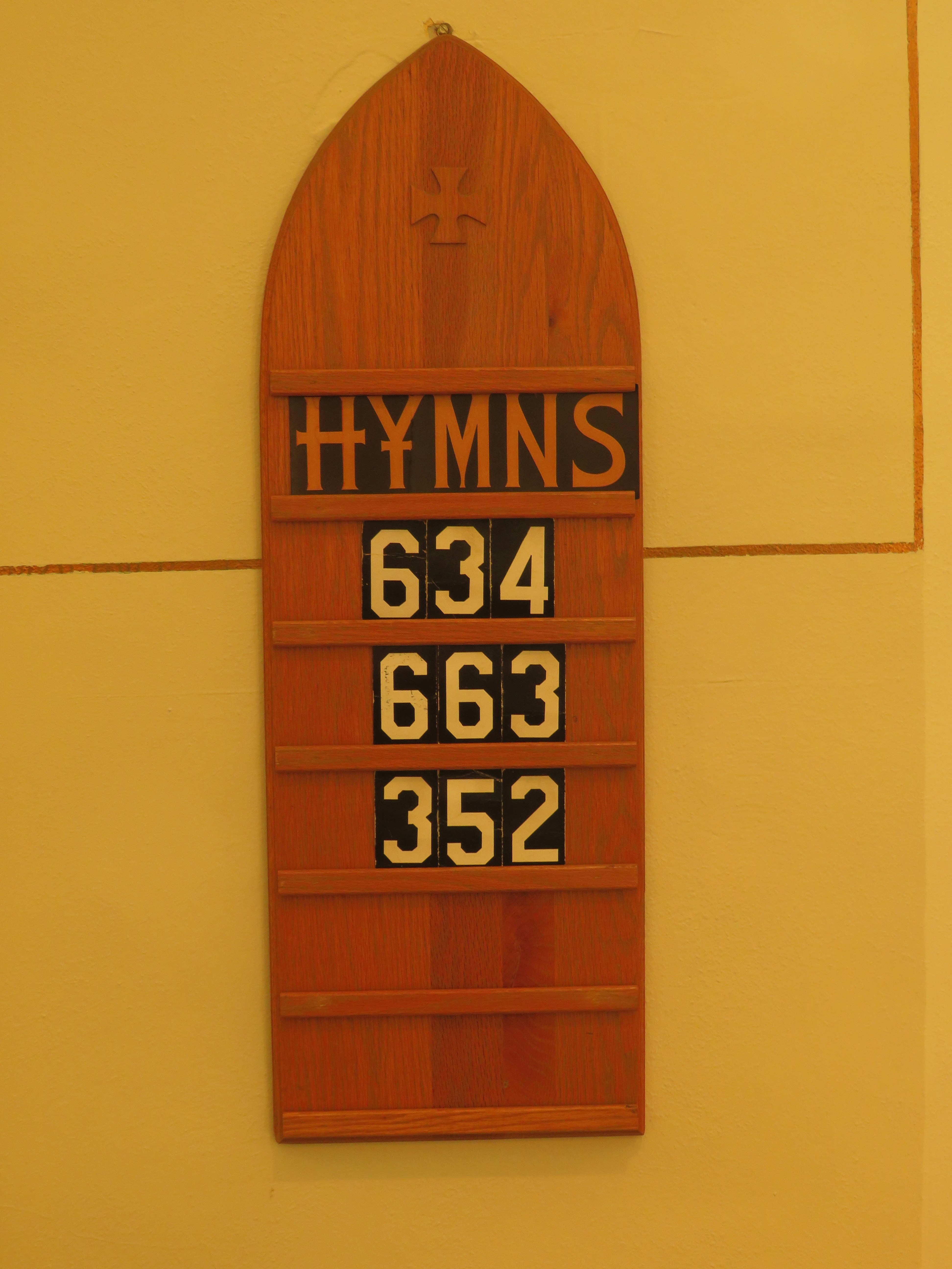 Wooden church hymn board with numbers