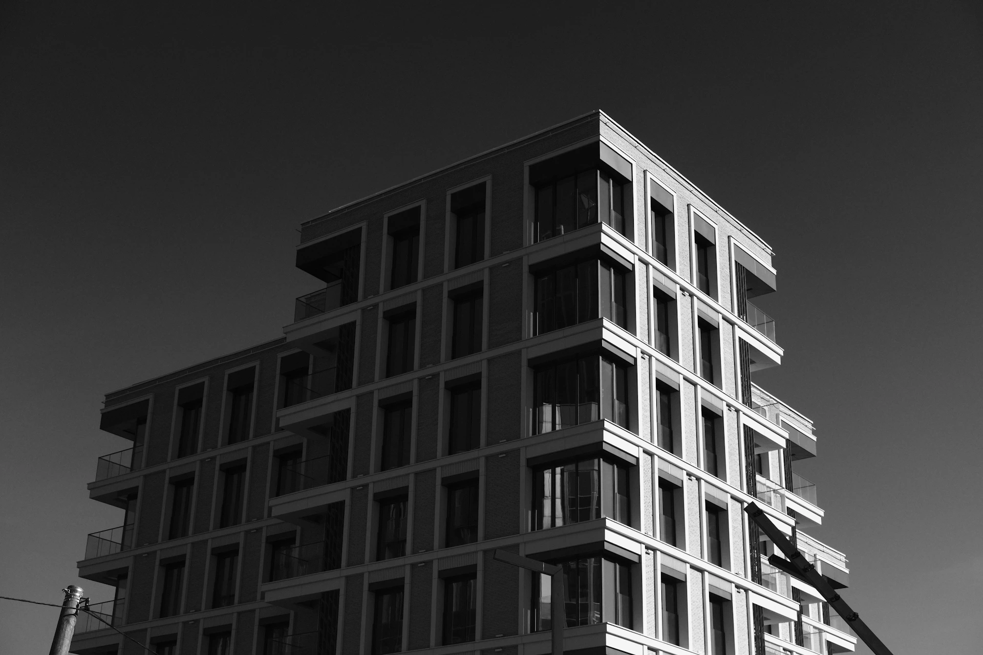Modern building with geometric facade against clear sky