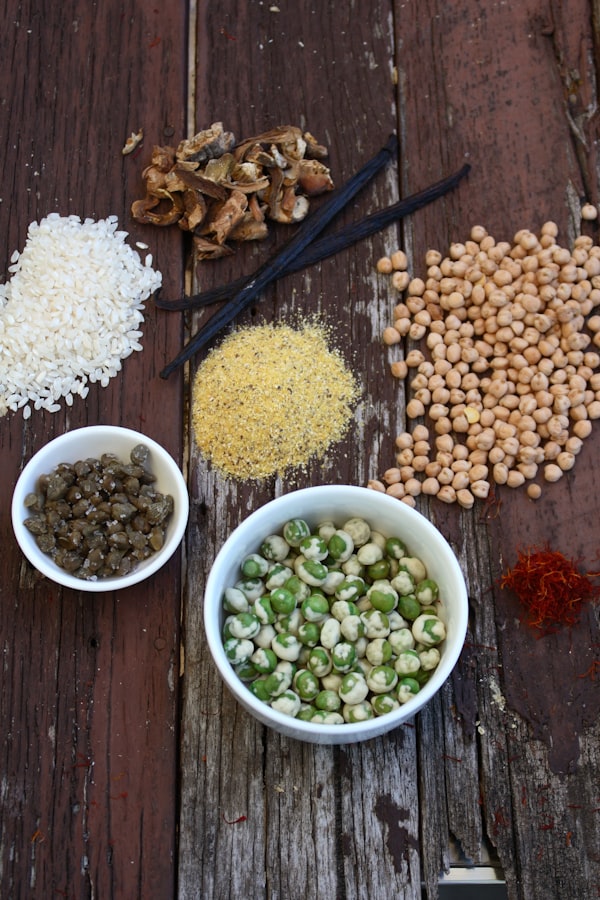 Assortment of grains and spices on wood