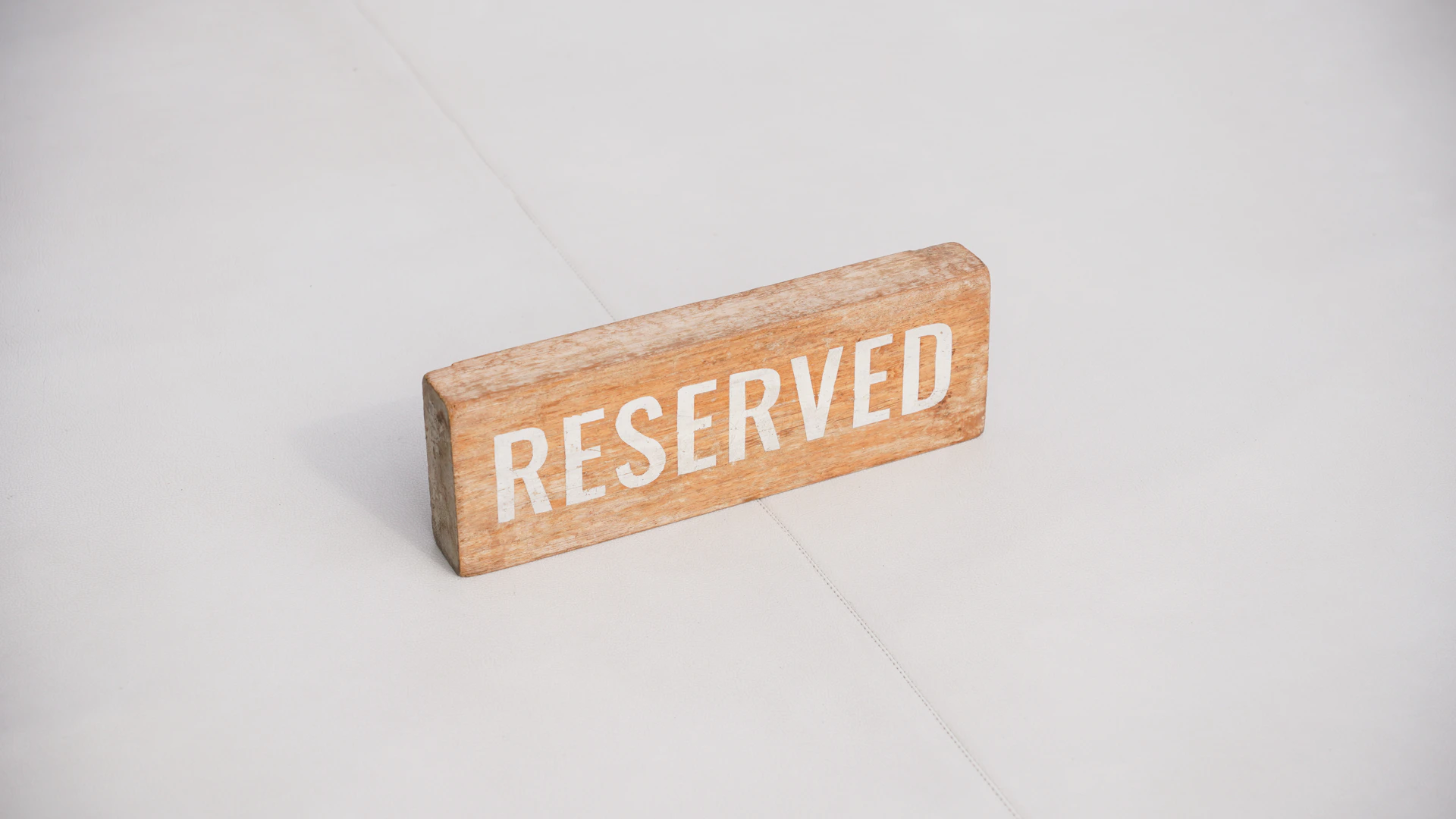 Wooden sign with the word reserved