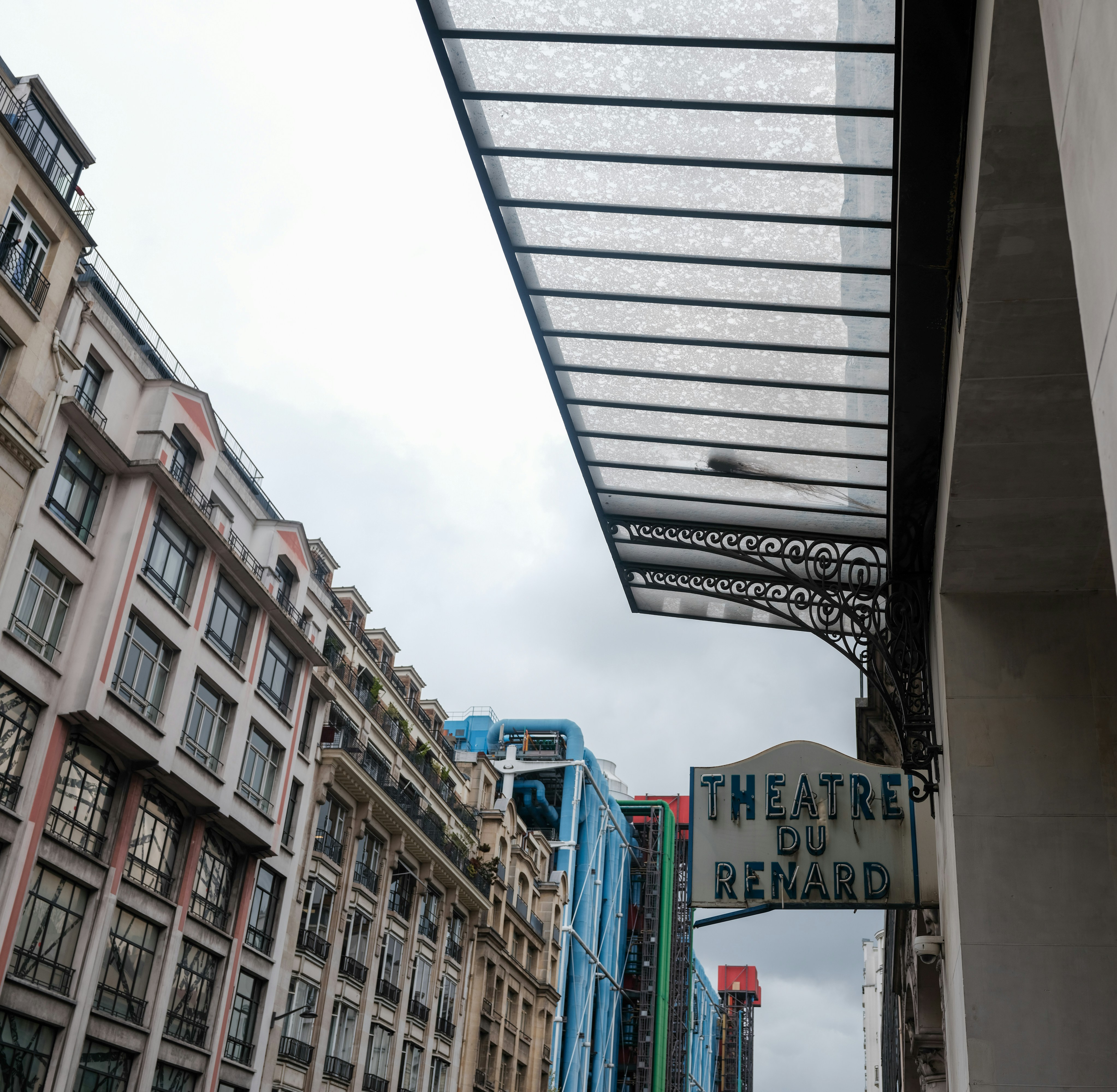 Theatre du renard sign on a cloudy day