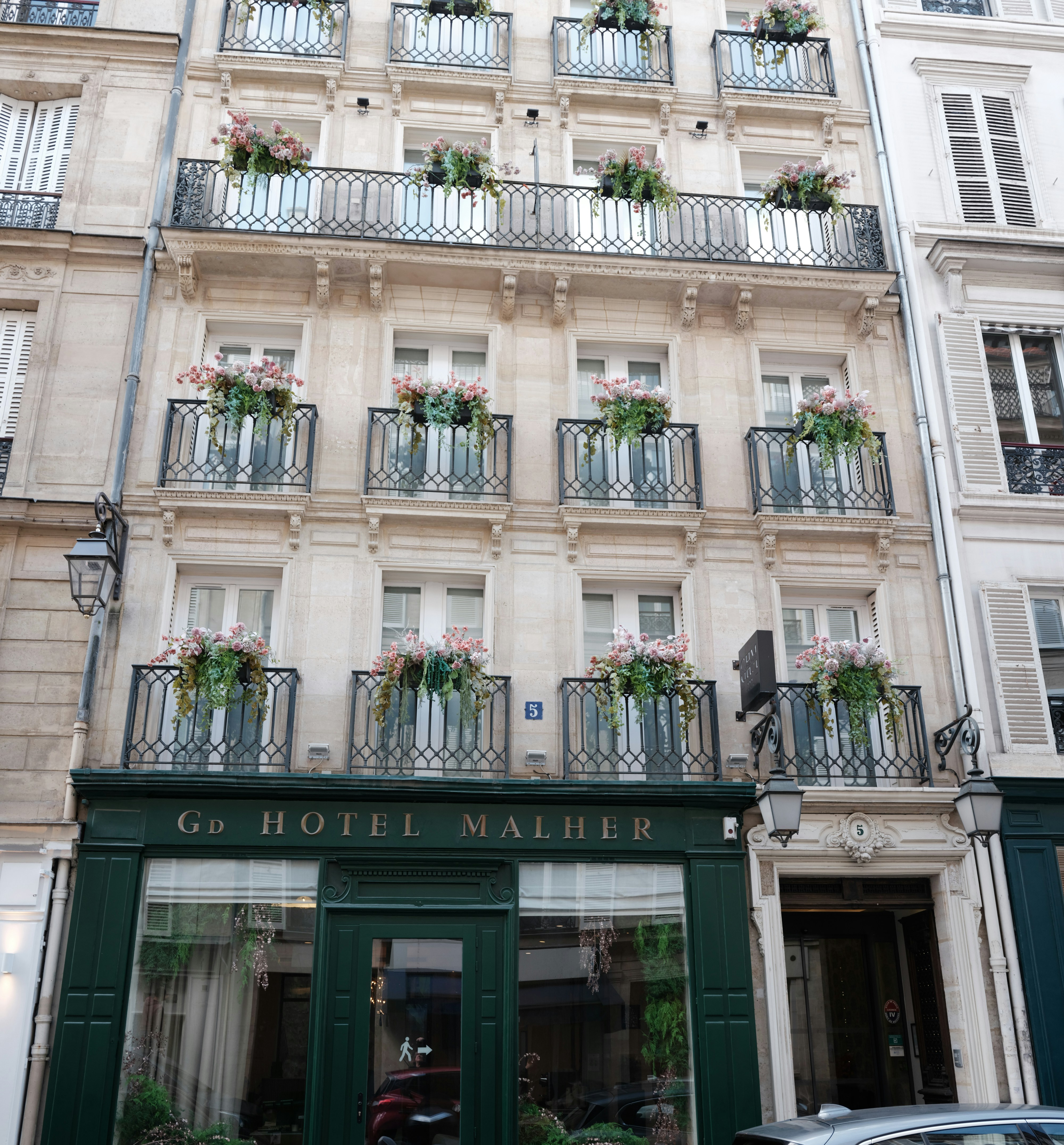 European hotel facade with classic balconies and architectural detail