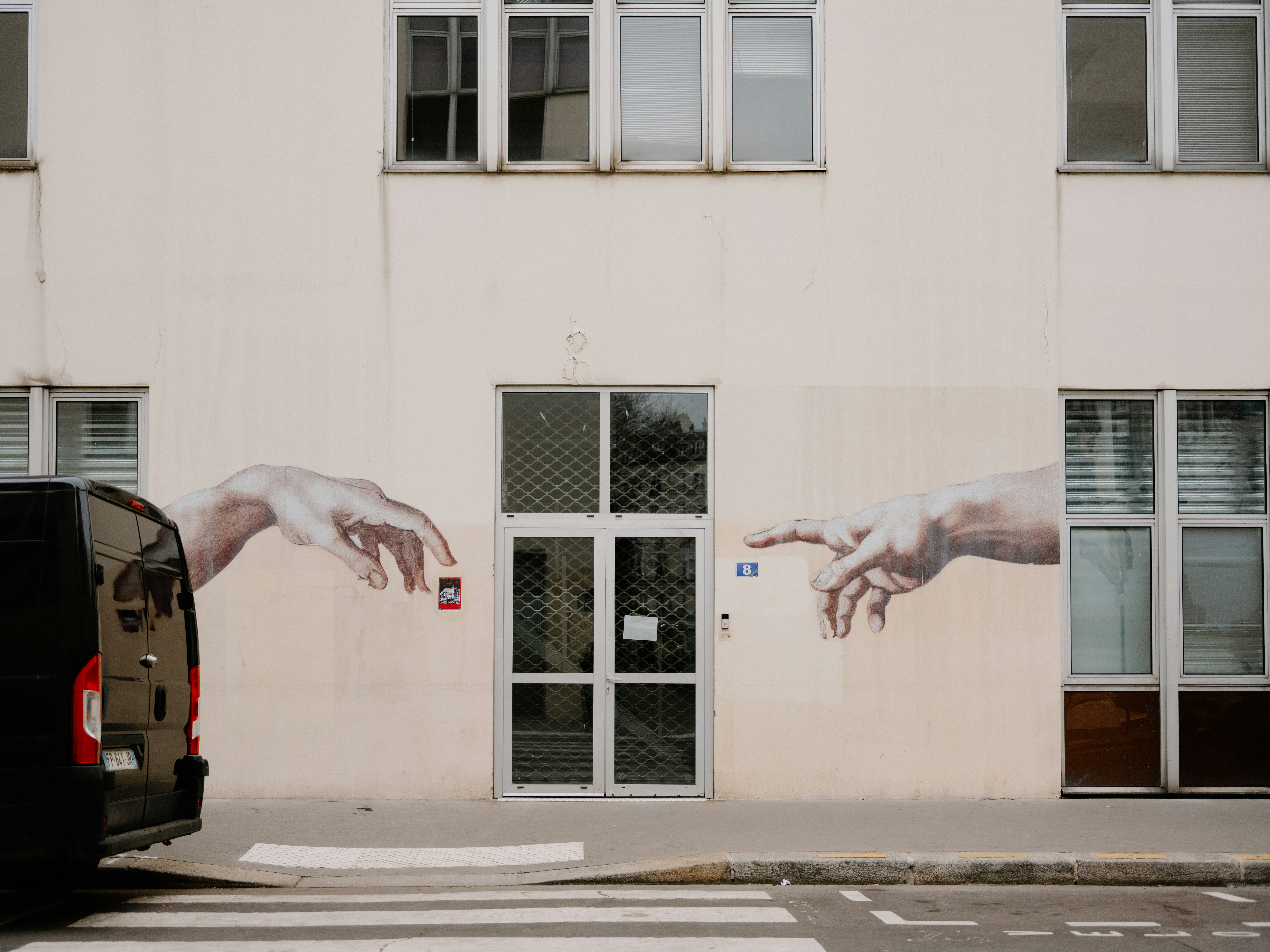 Mural of two hands reaching towards each other