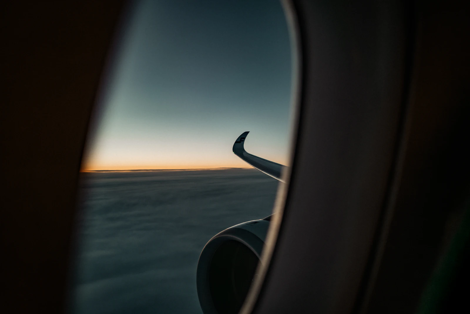 Airplane wing at sunset