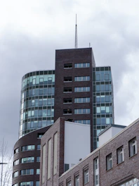 Modern office buildings against a cloudy sky