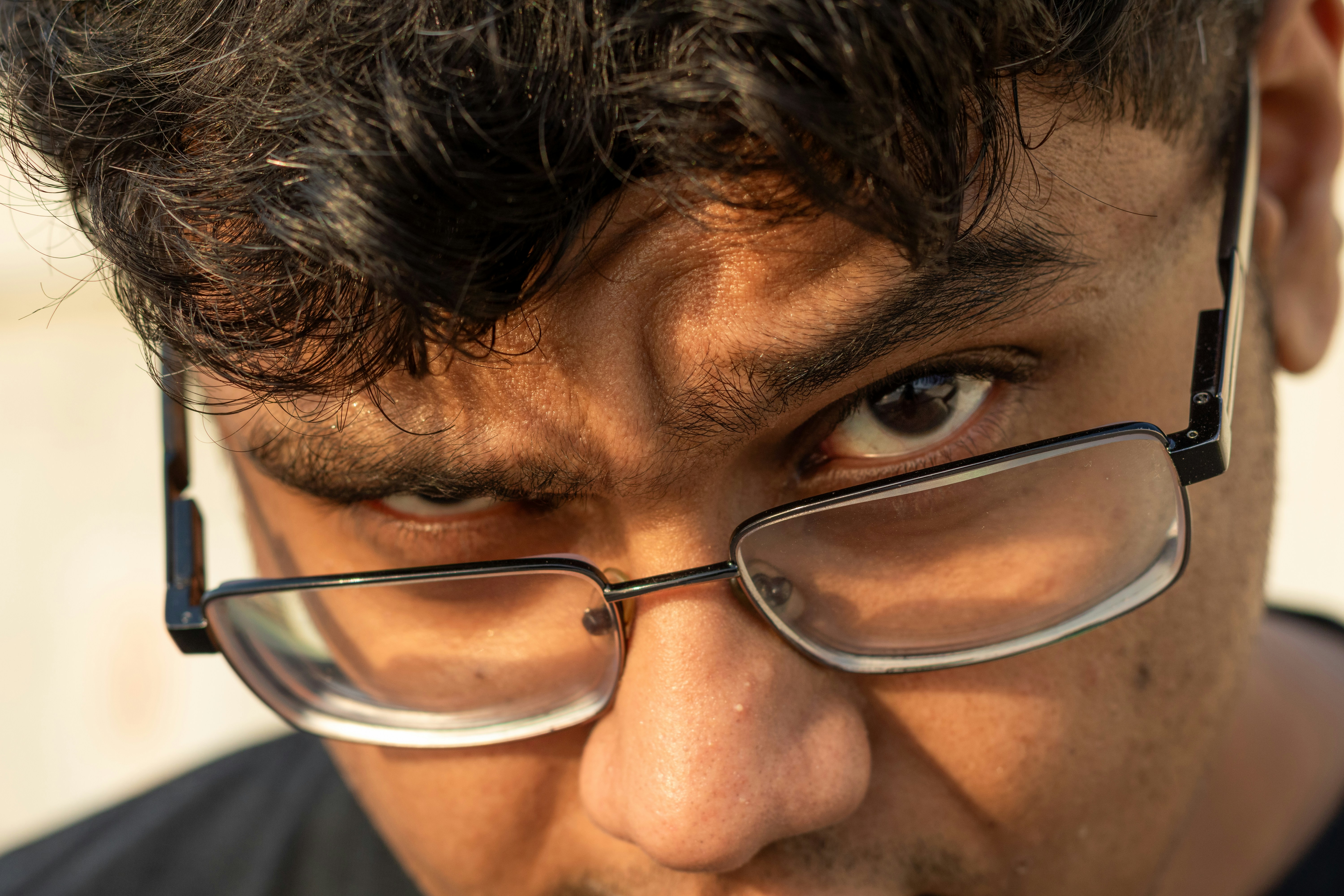 Close-up of a young man wearing glasses
