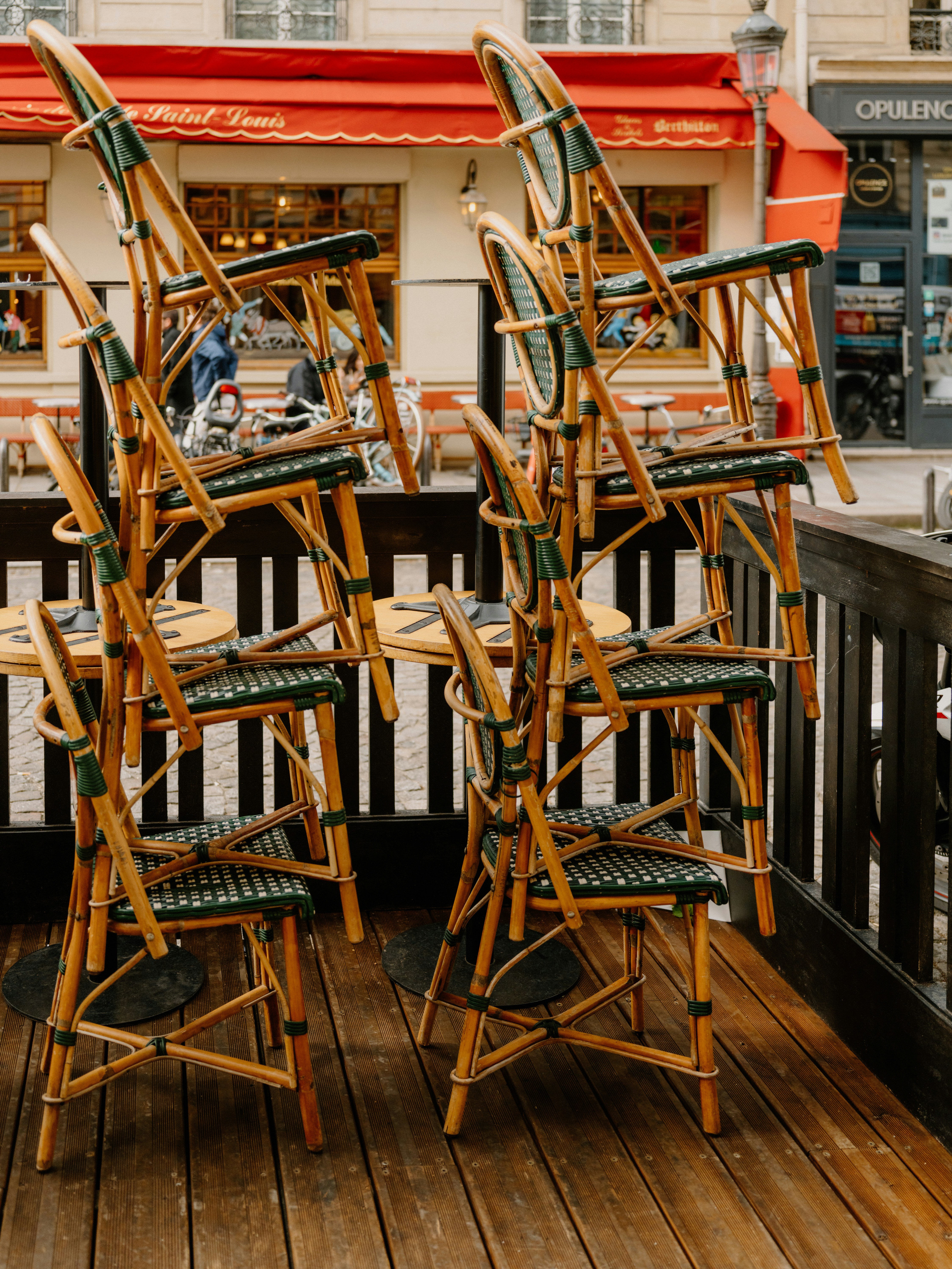 Stack of chairs outside a closed cafe