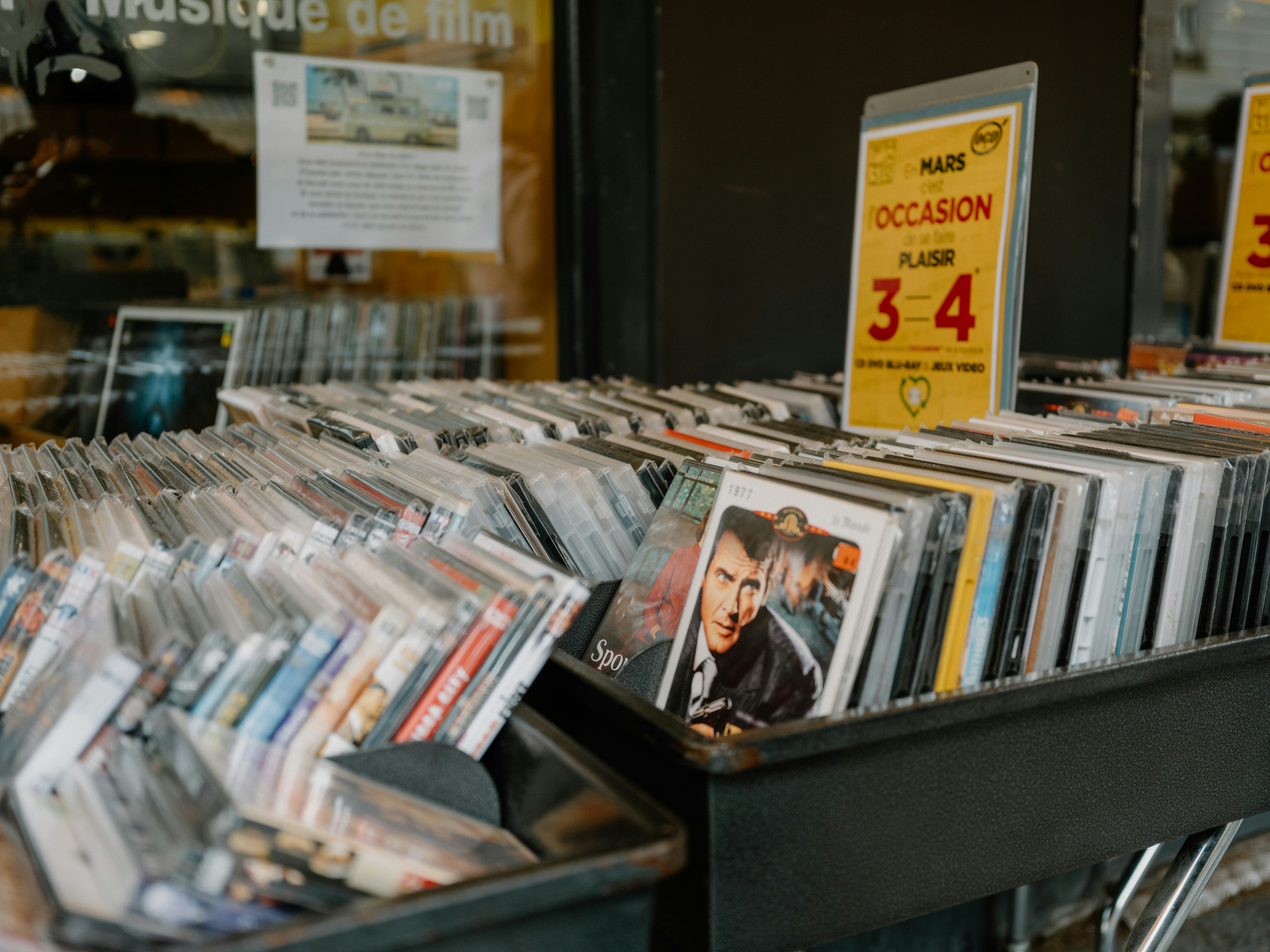 Rows of dvds and cds displayed for sale