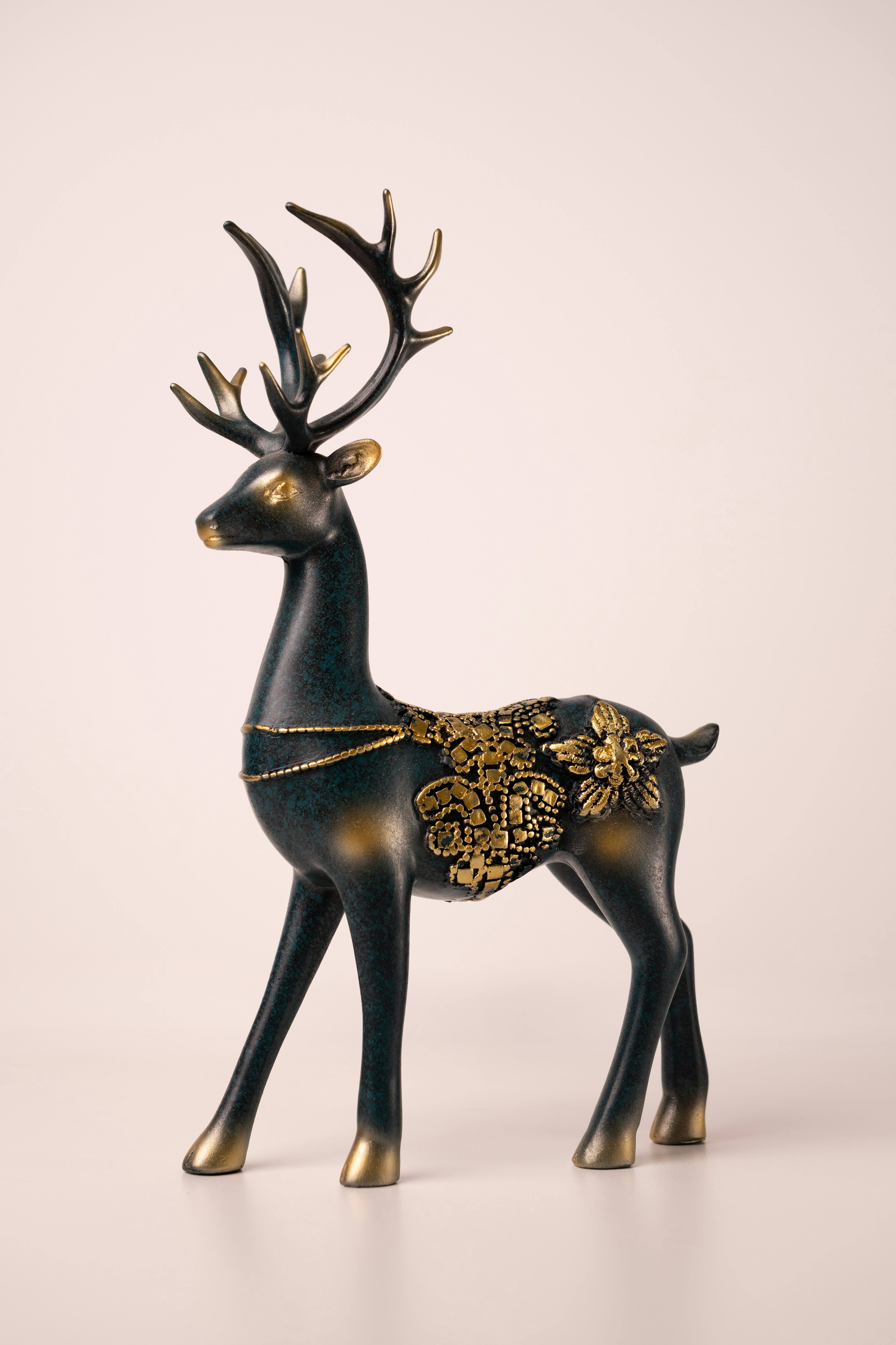 Decorative deer statue with ornate gold detailing