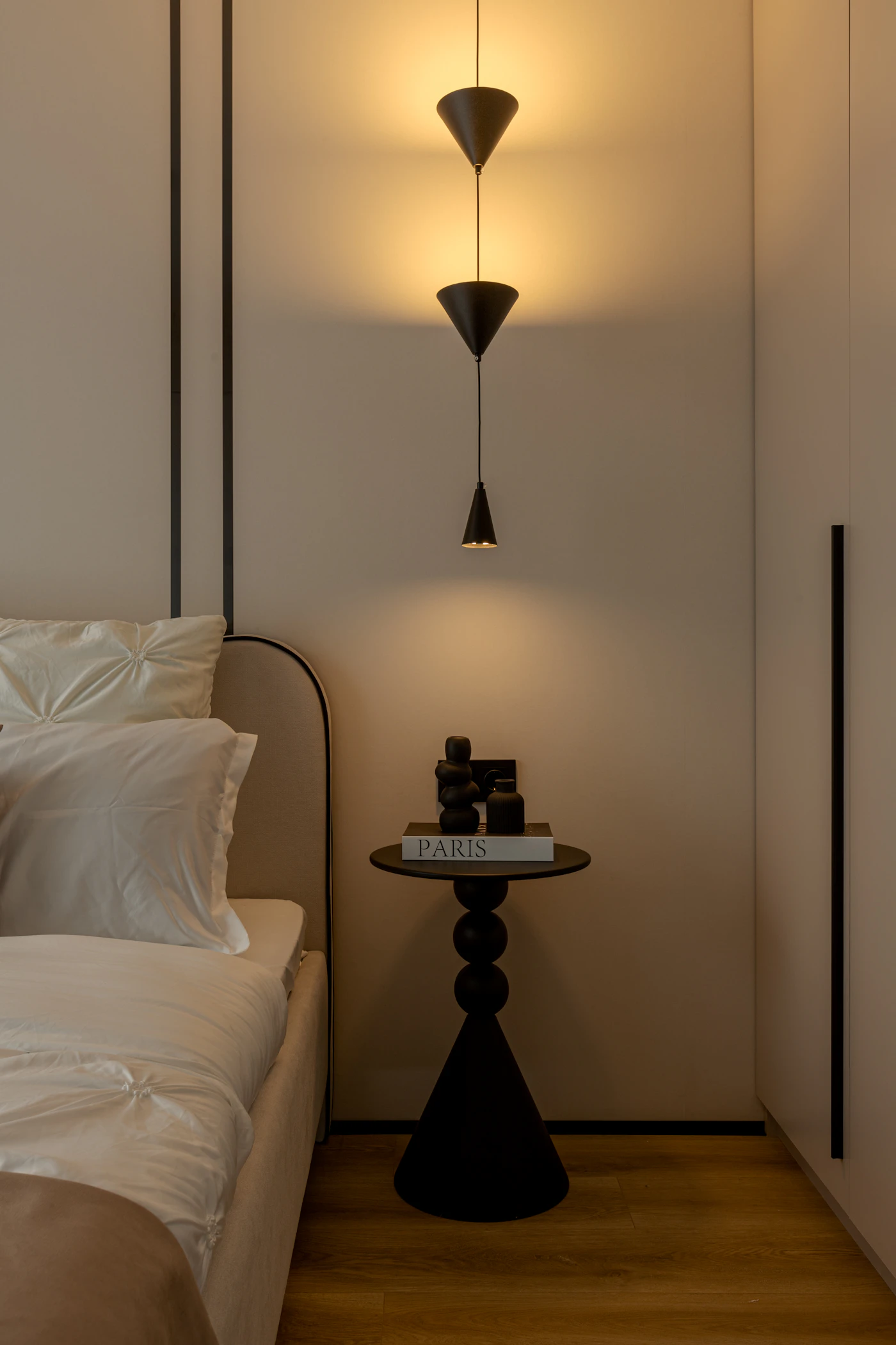 Minimalist bedroom styled with warm candlelight and natural home decor