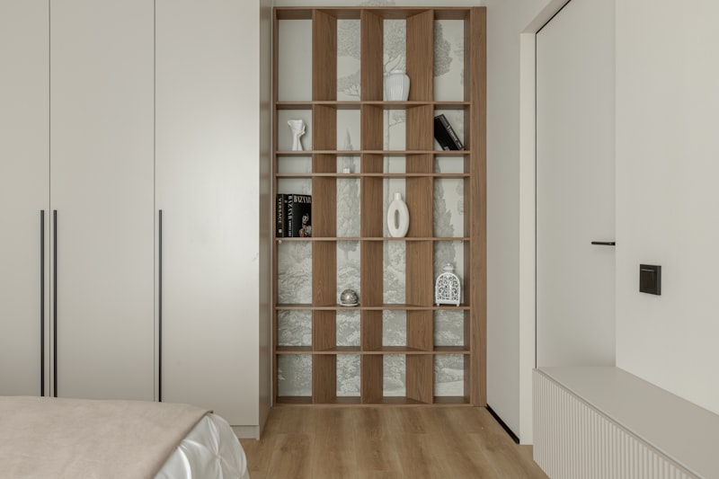 Minimal bedroom with open shelving and warm lighting