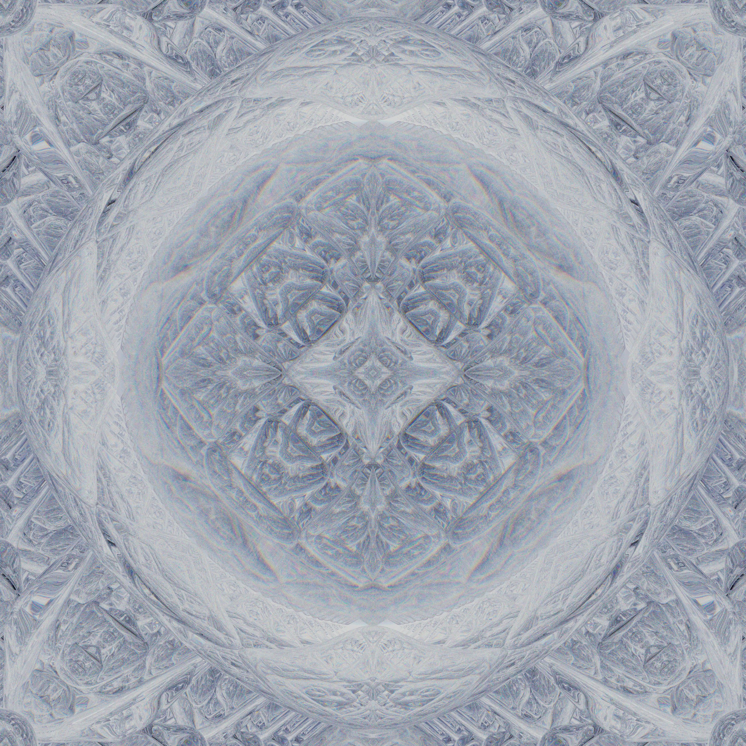 Abstract symmetrical pattern with white and blue tones.
