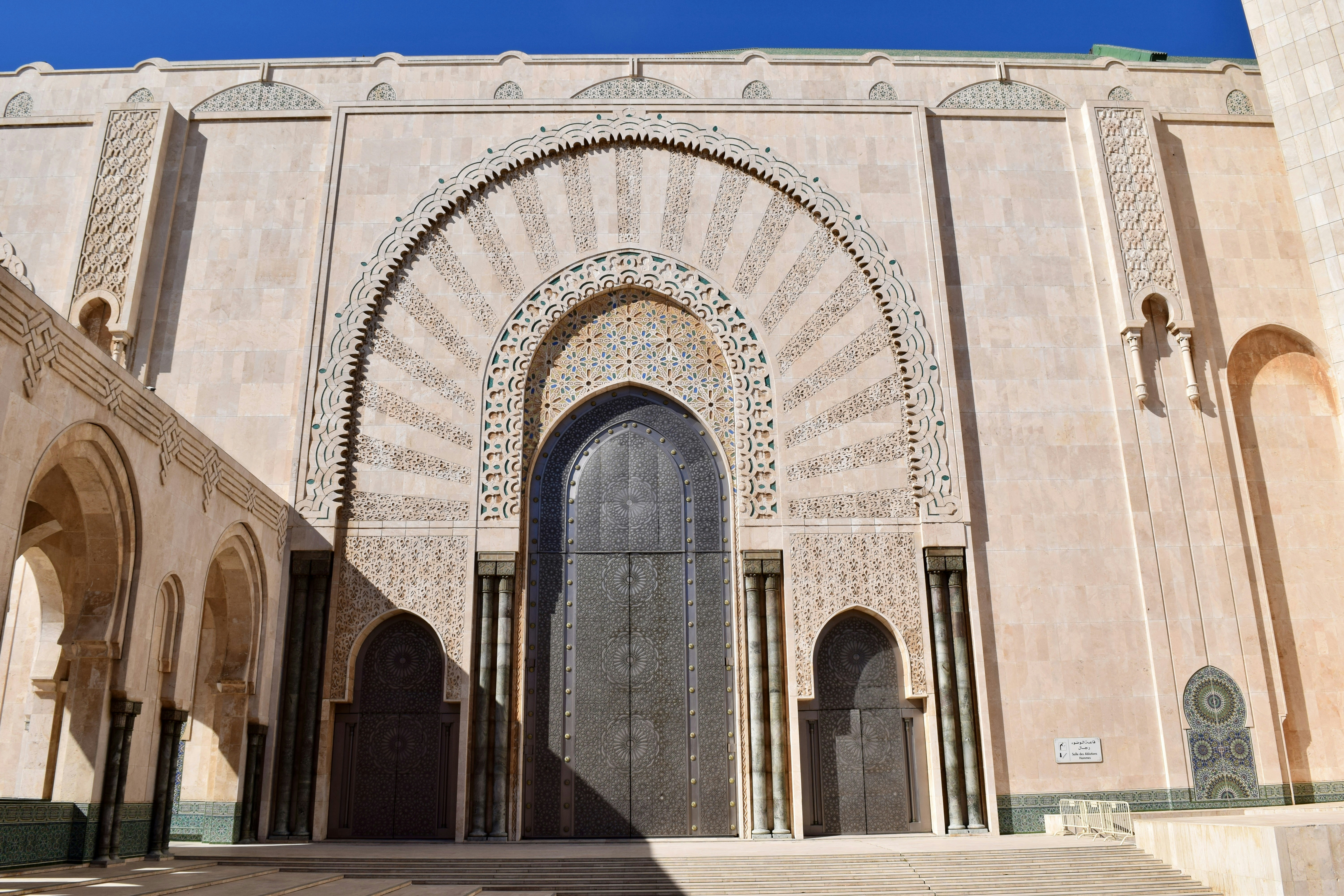 Grand arched entrance of a large mosque