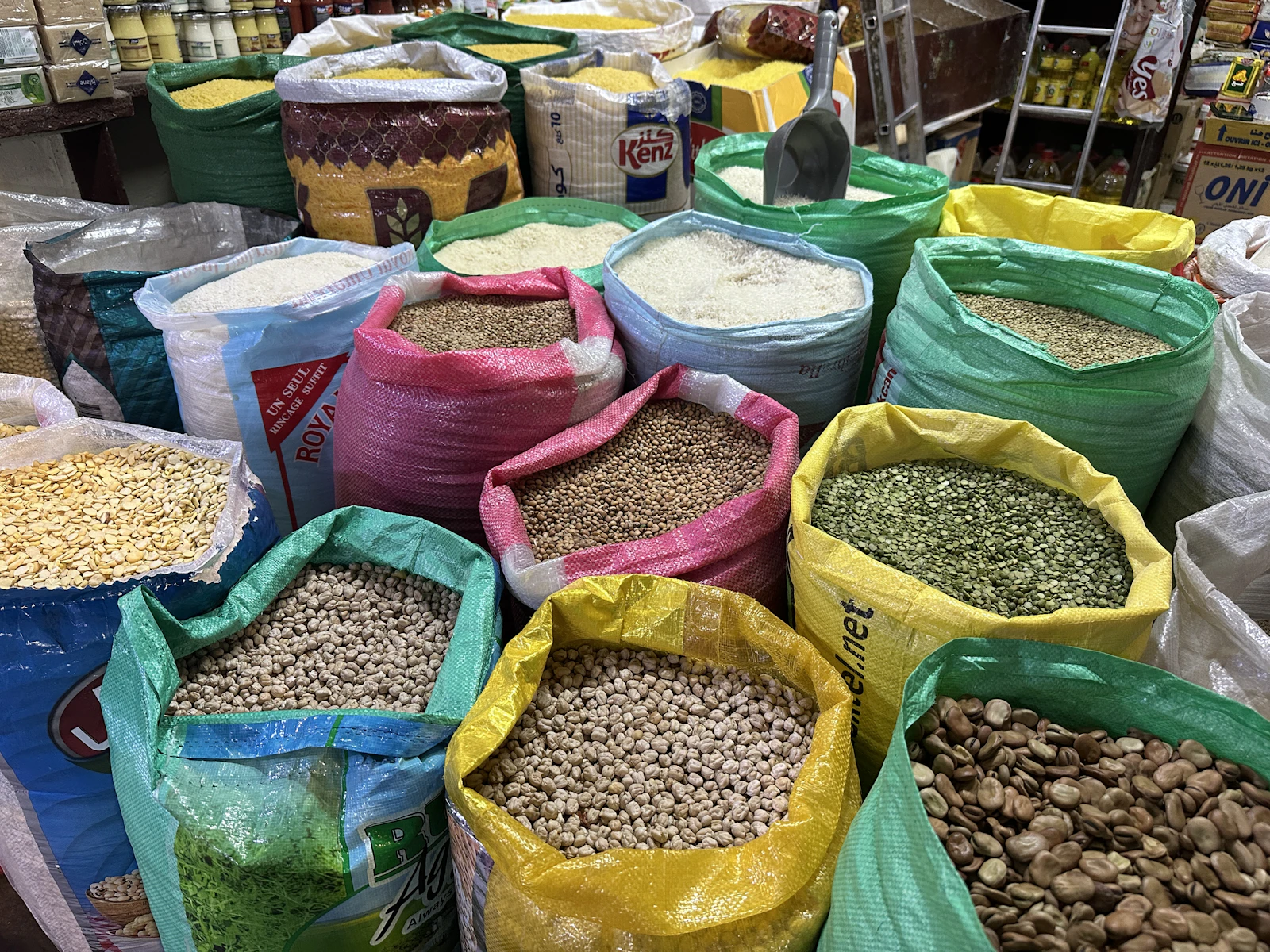 Illustrative image for vegan food in cairo: ful, taameya and koshari: Open market sacks filled with lentils, beans, rice and other dry staples.