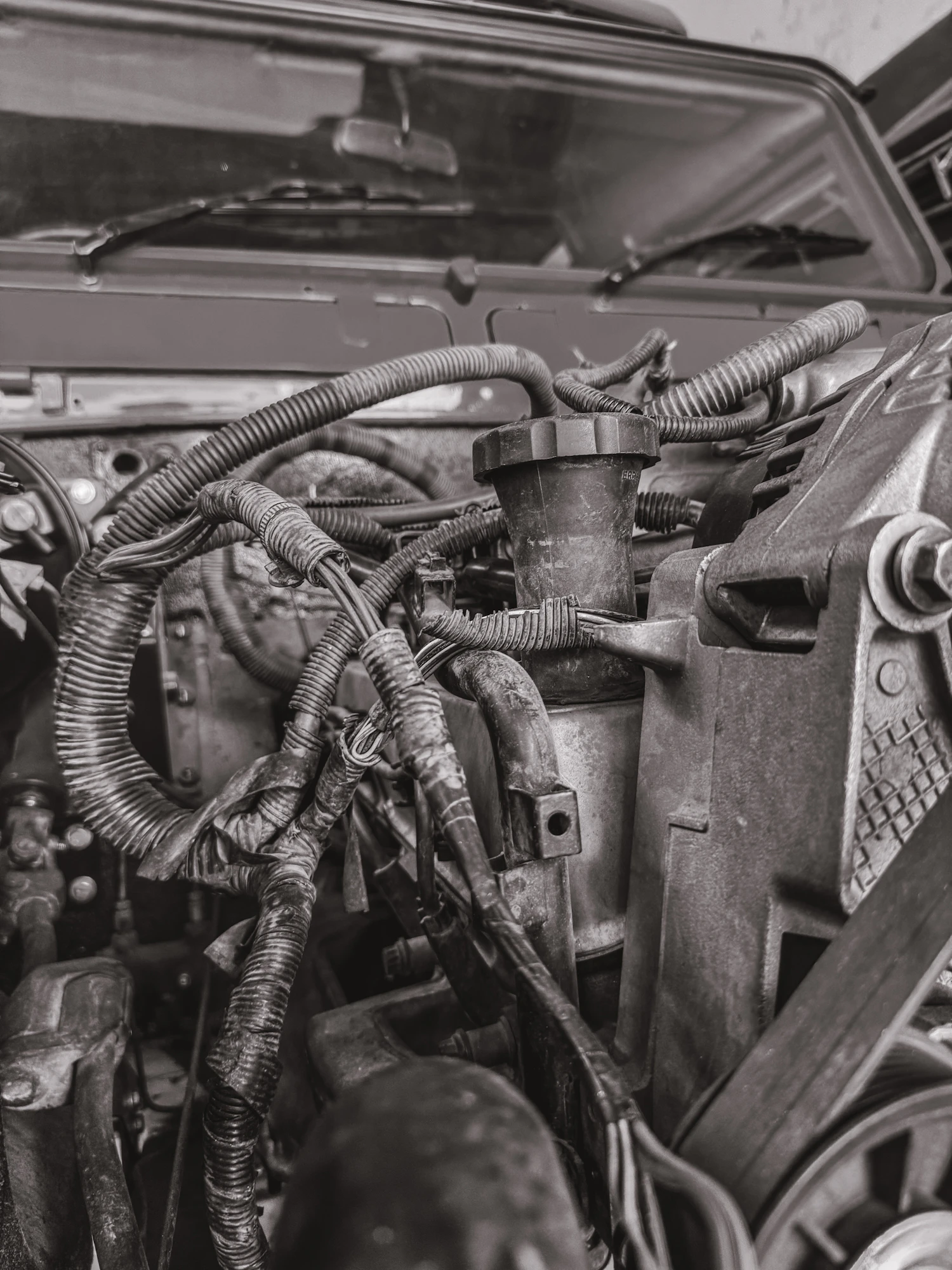 Auto-electrical technician repairing car wiring harness at Kenya Car Guy Nairobi