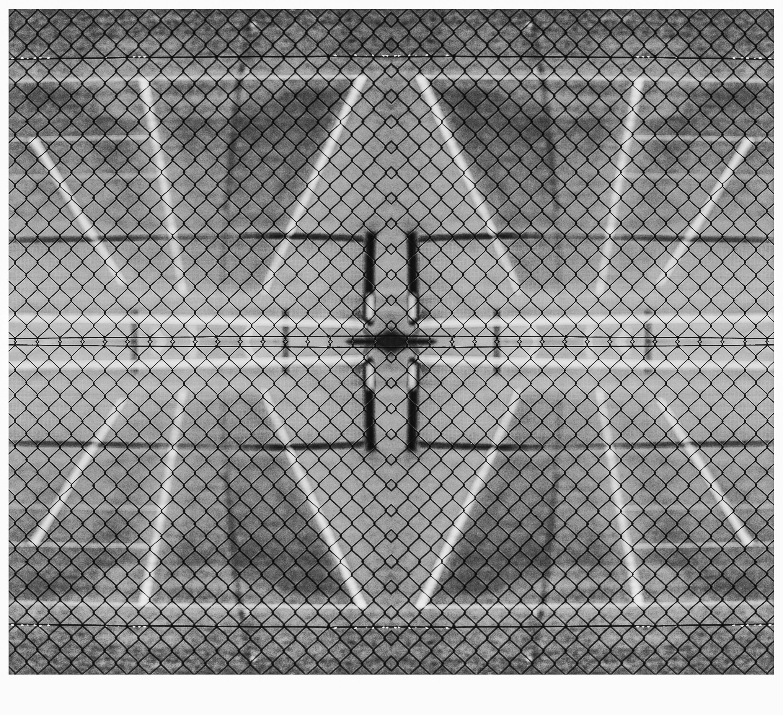 Symmetrical abstract pattern of a tennis court fence