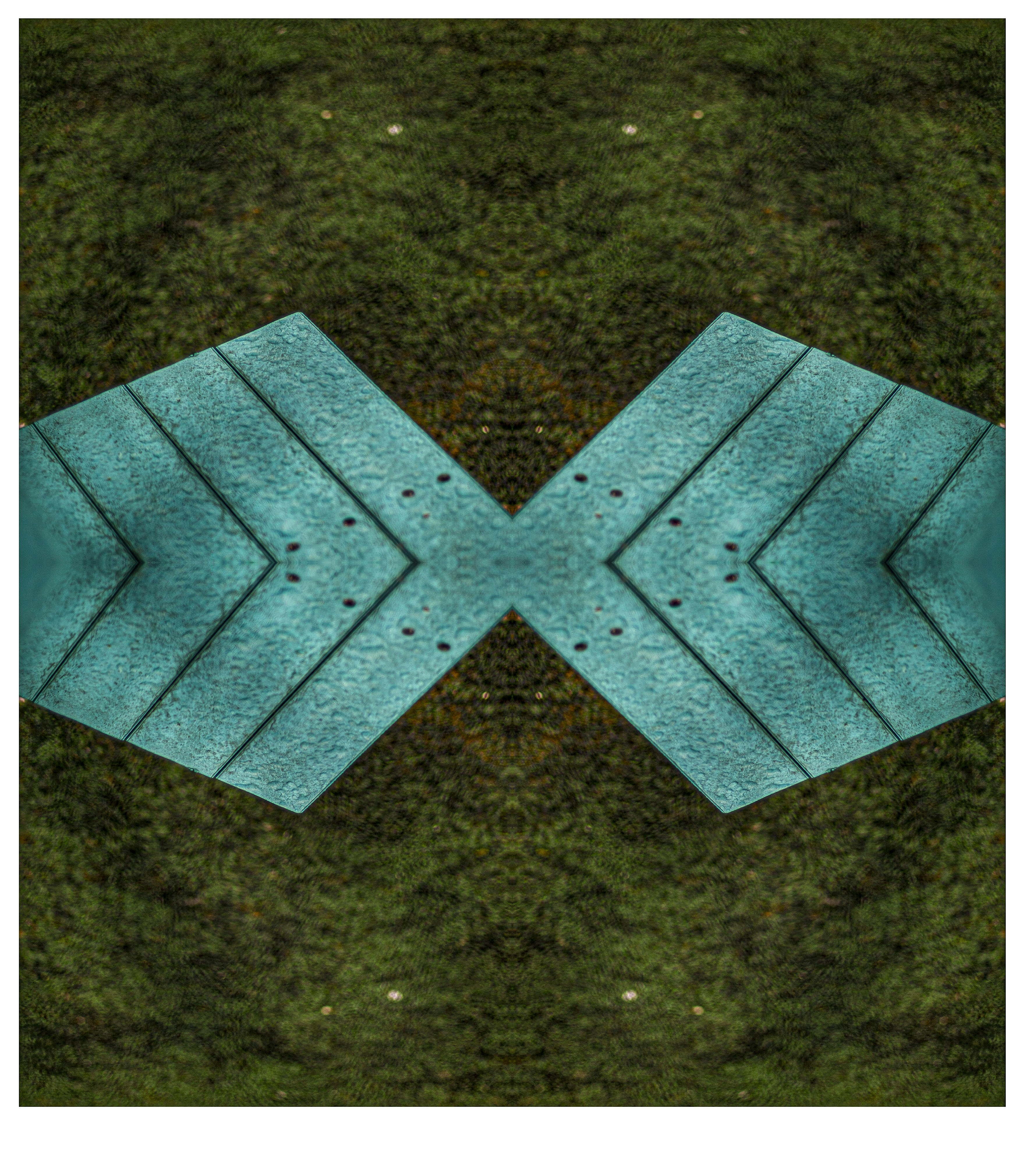 Symmetrical teal planks against a grassy background