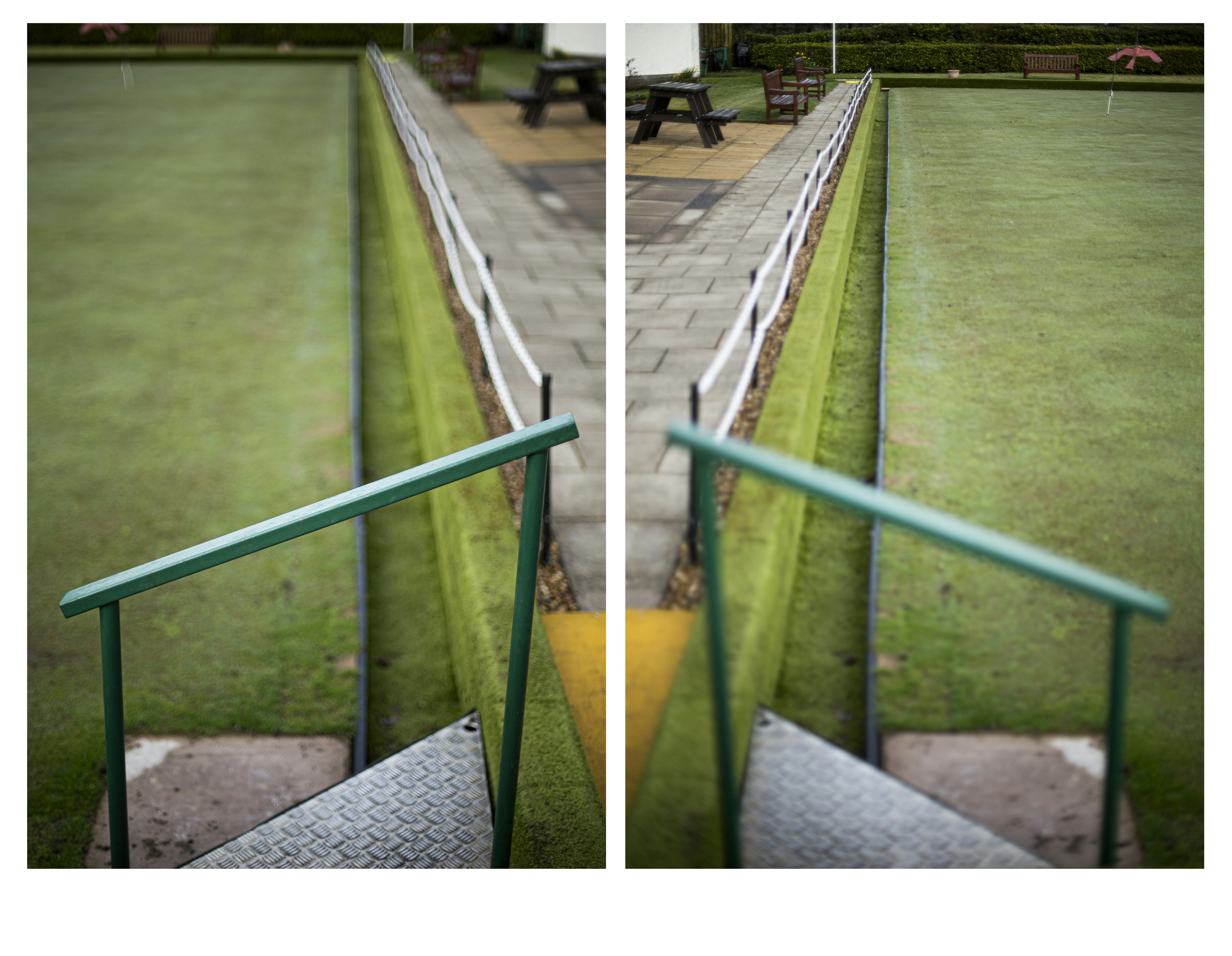 Green lawn bowling green with steps and railing