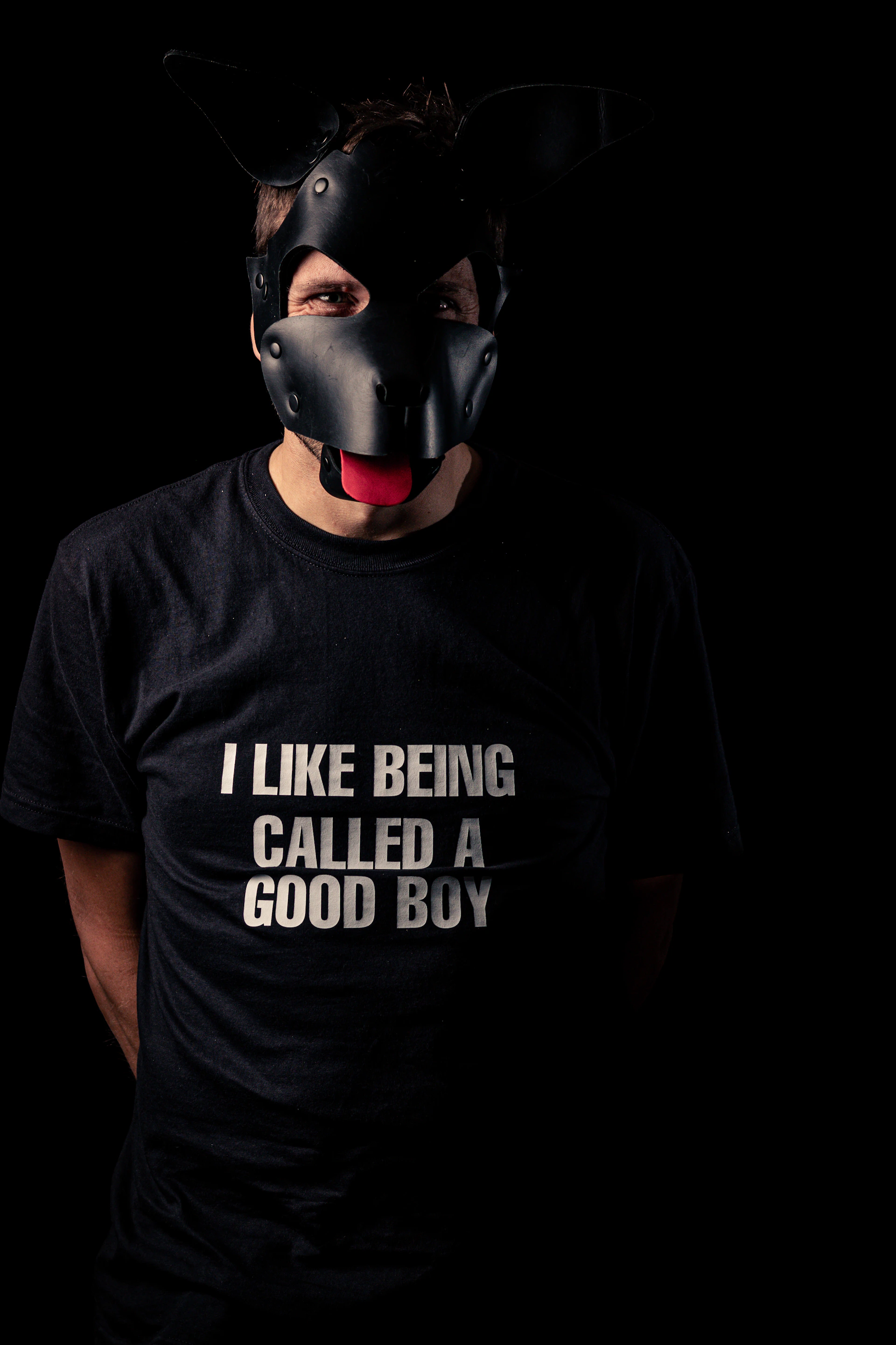 Man wearing a dog mask and t-shirt