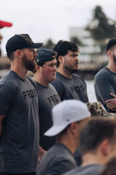 Group of men wearing matching "pros" t-shirts