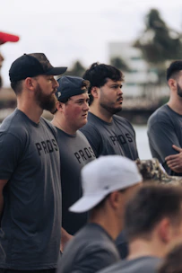 Group of men wearing matching "pros" t-shirts