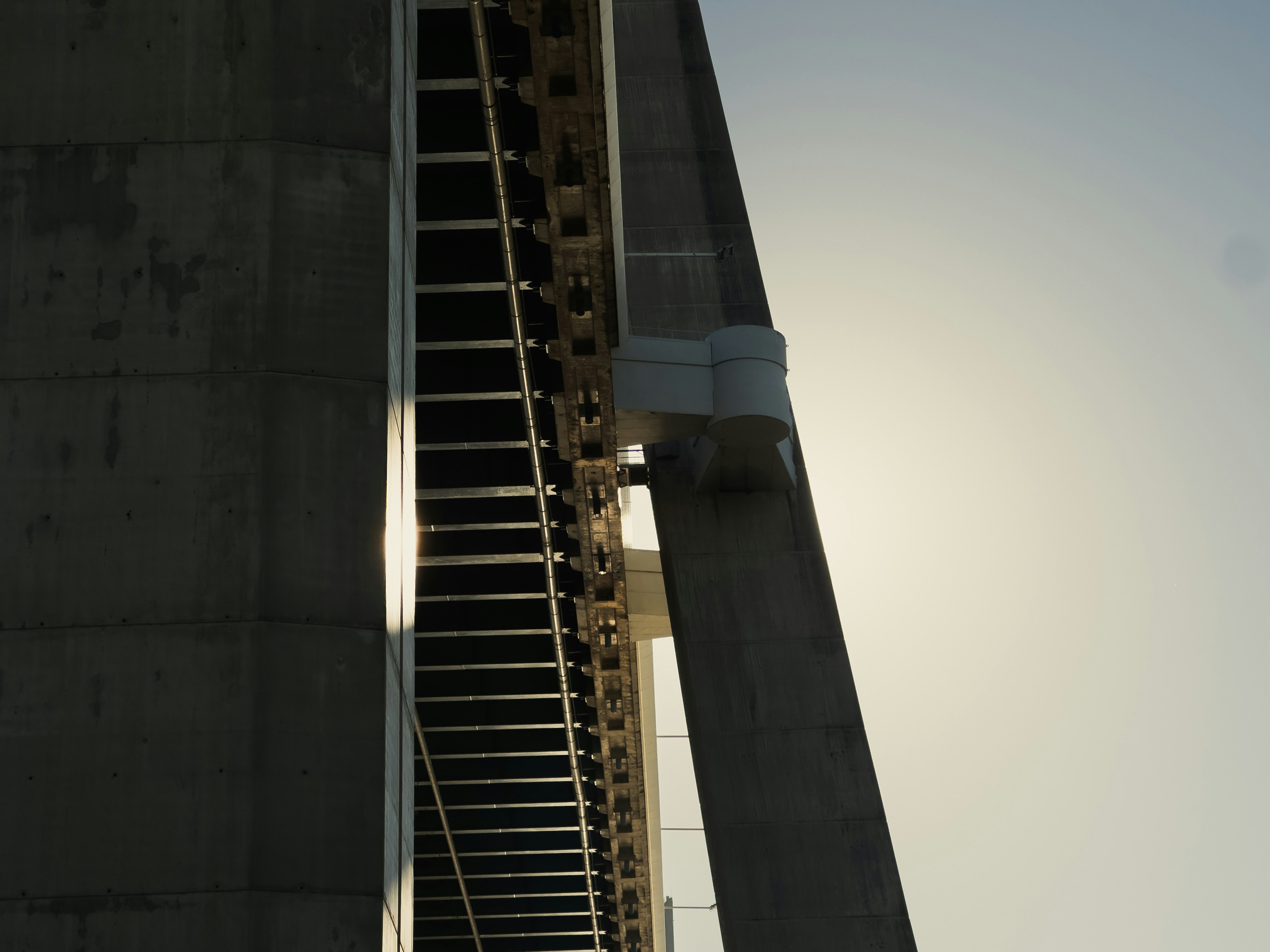 Close-up view of a modern bridge structure against the sky
