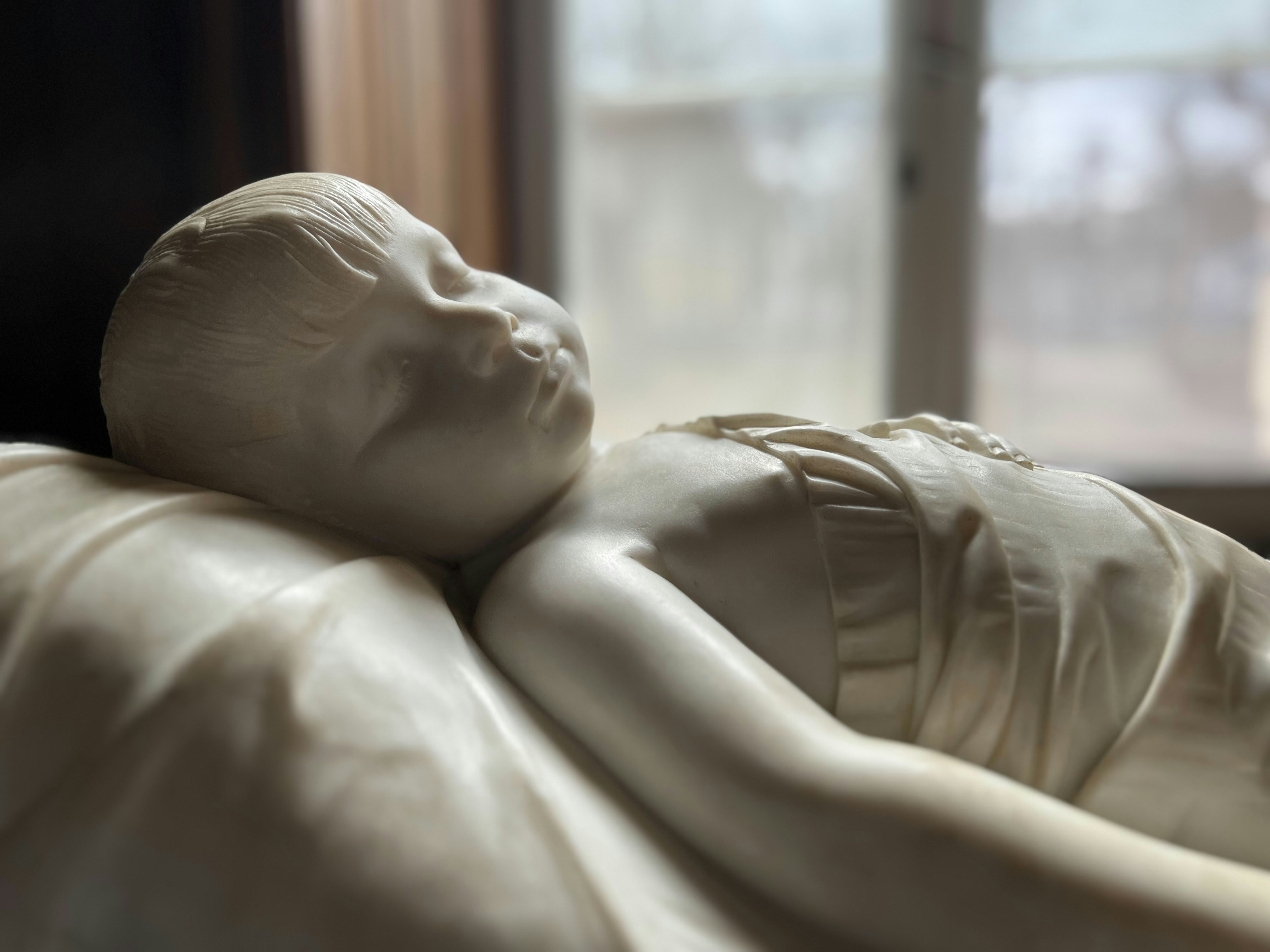 Marble sculpture of a sleeping child